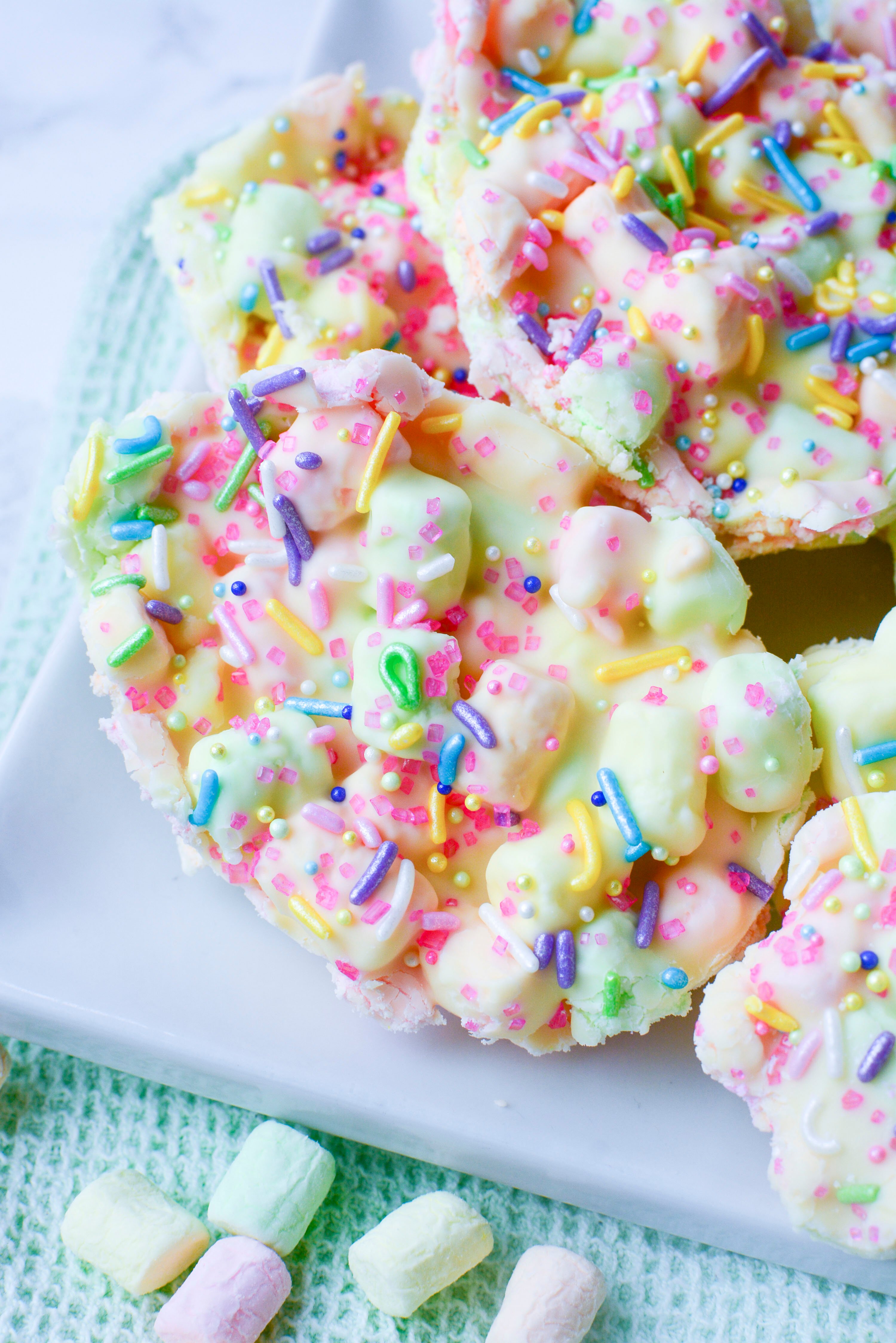 Easter Marshmallow treats with pink, green and yellow mini marshmallows cut into the shape of eggs