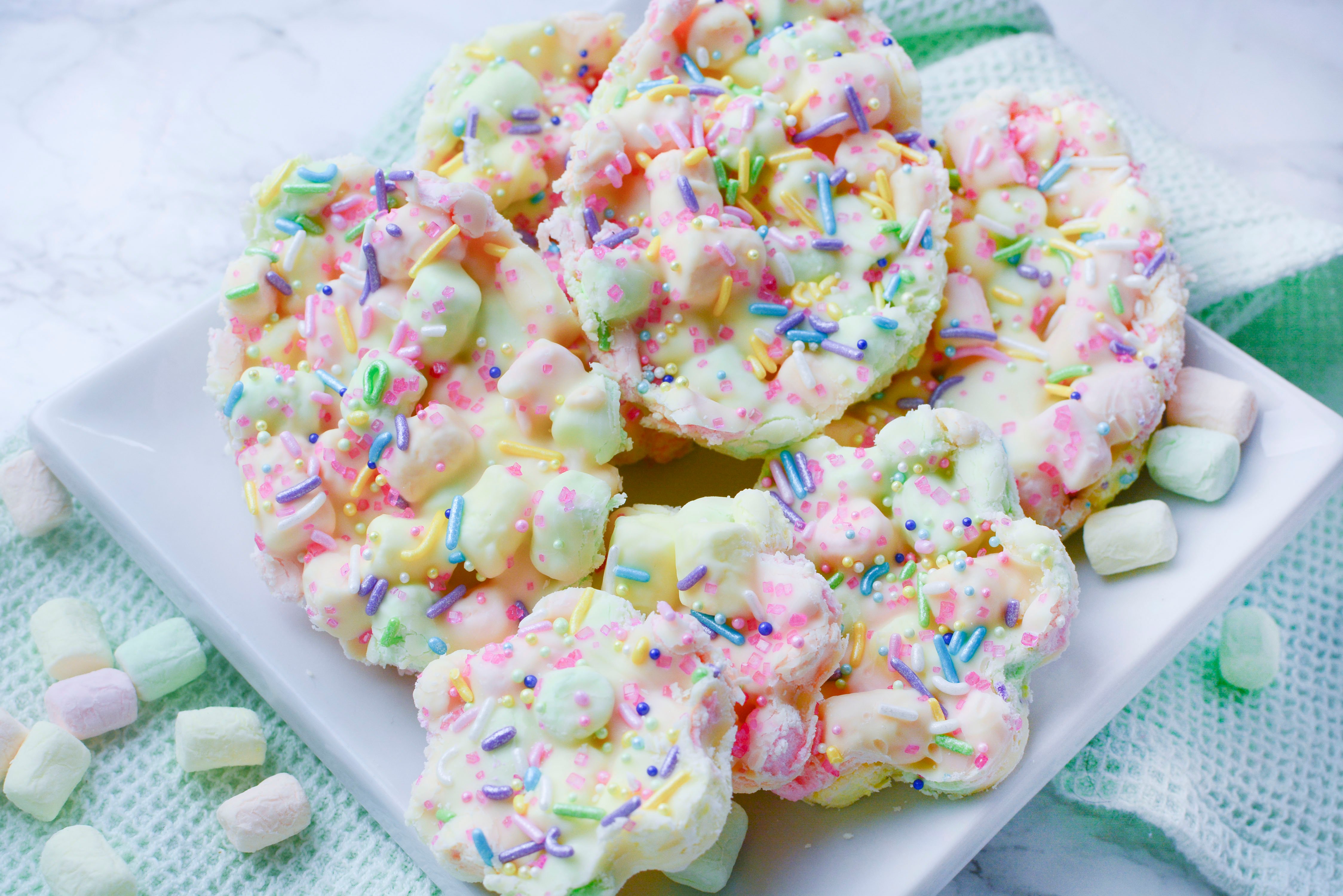 Easter Marshmallow treats with pink, green and yellow mini marshmallows cut into the shape of eggs