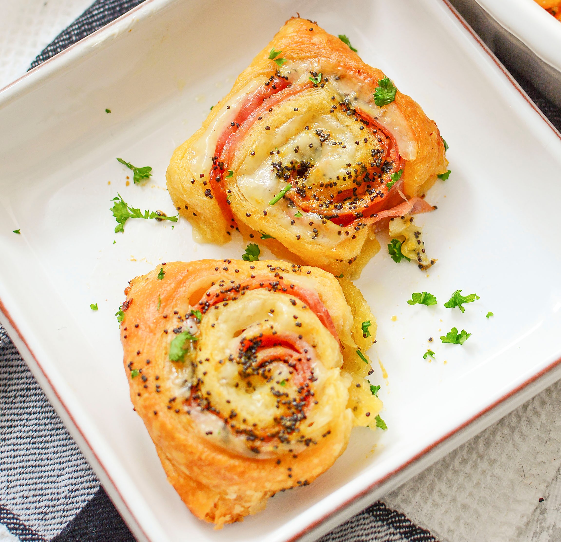 Ham and Cheese Pinwheels on a white square plate