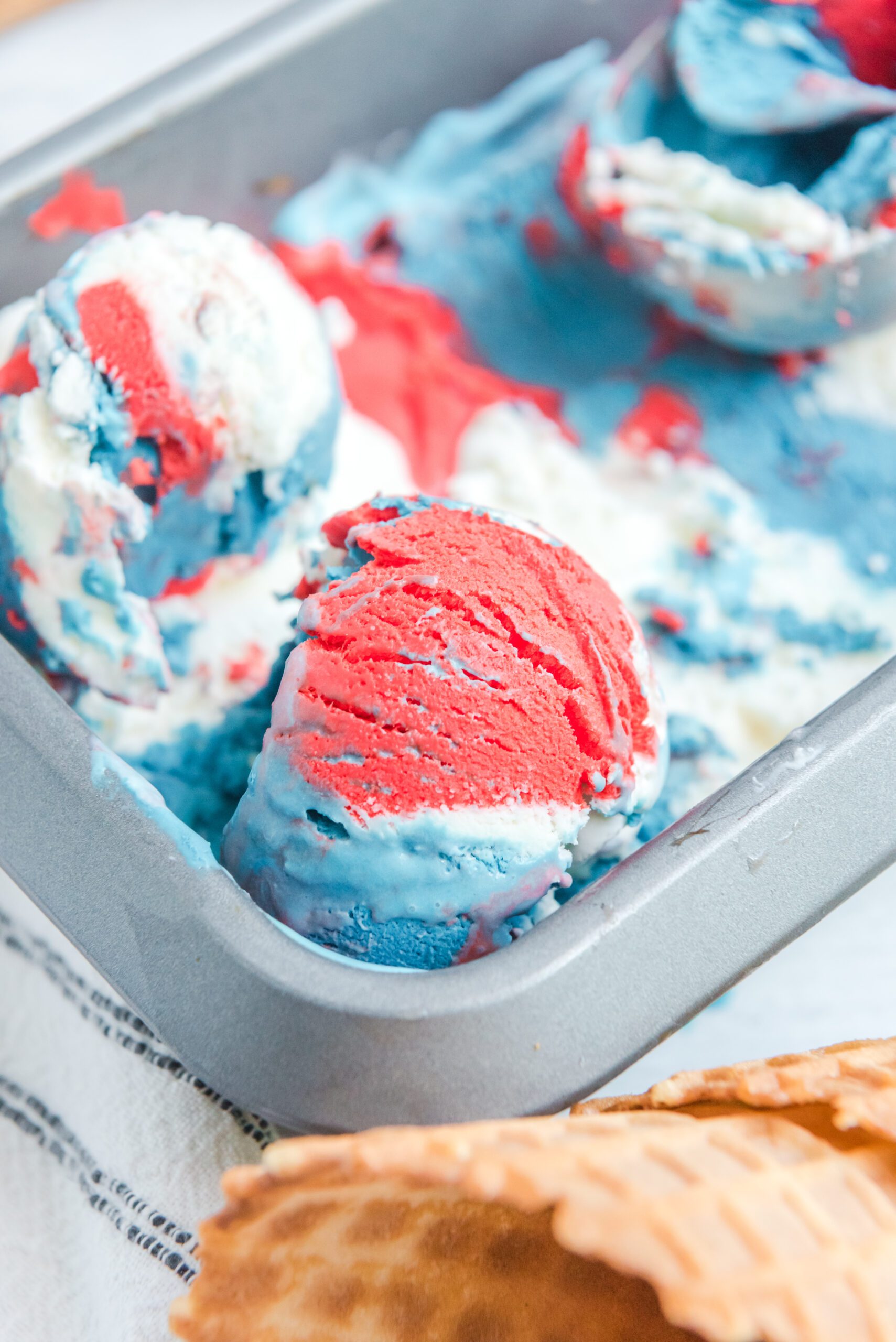 Red, White & Blue Ice Cream in a ice cream tin pan from the side