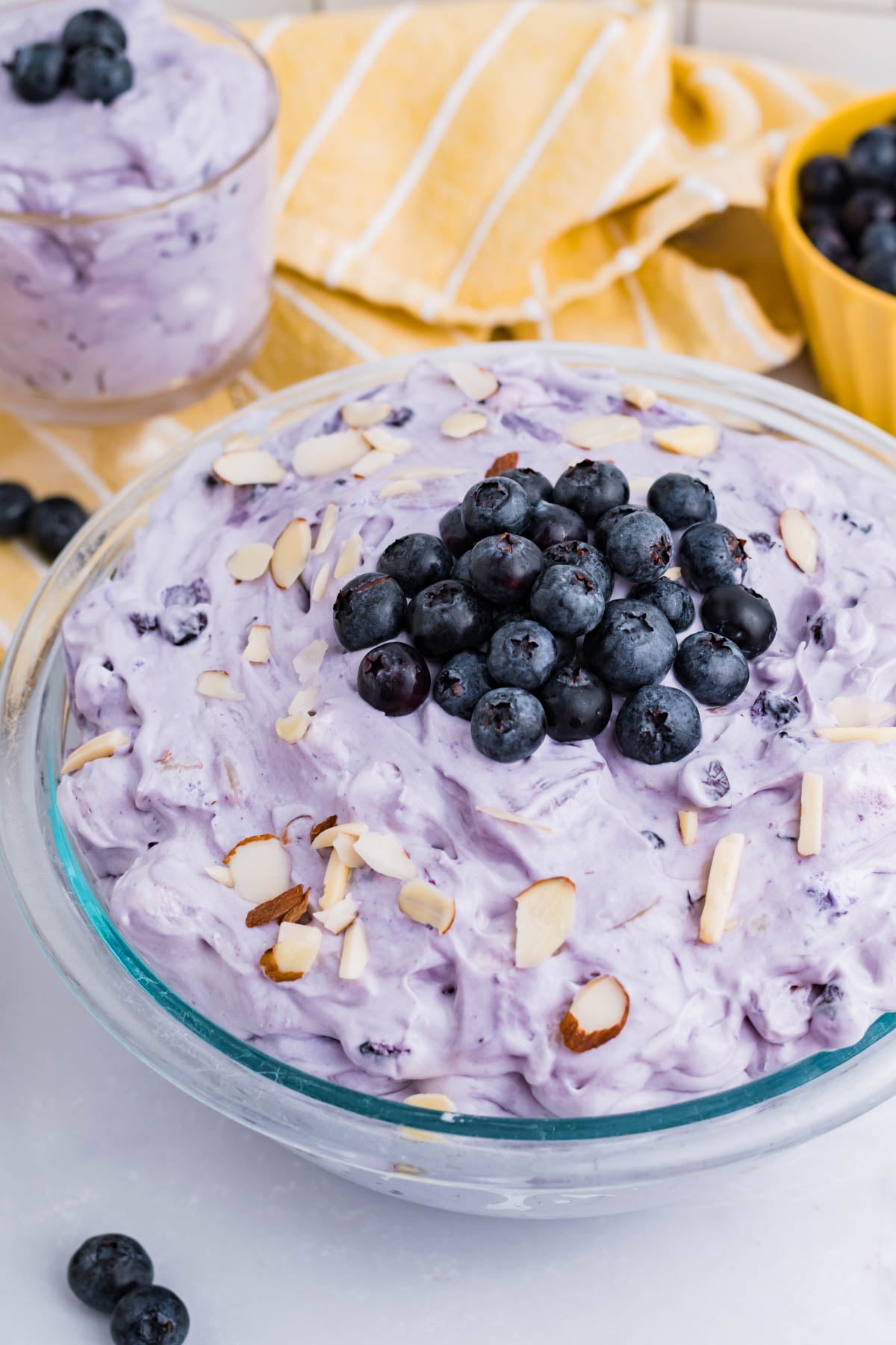 Blueberry Fluff Salad in a clear glass serving bowl overhead shot