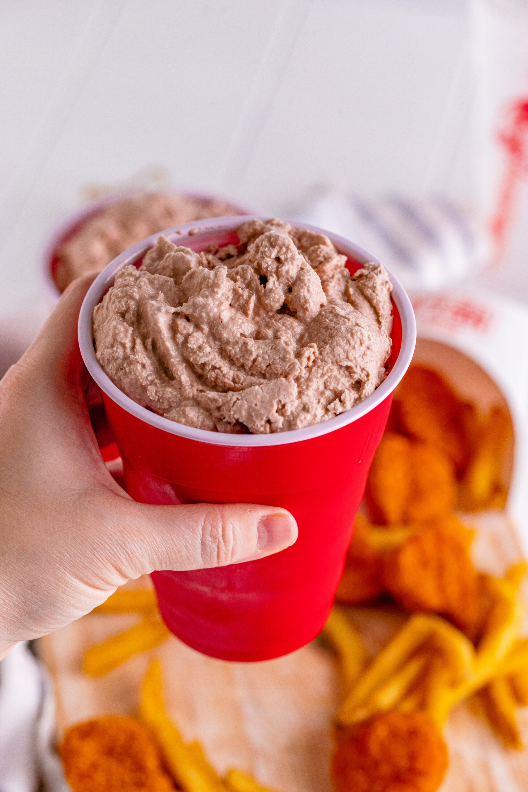 Wendys Frosty homemade in a red solo cup being held up