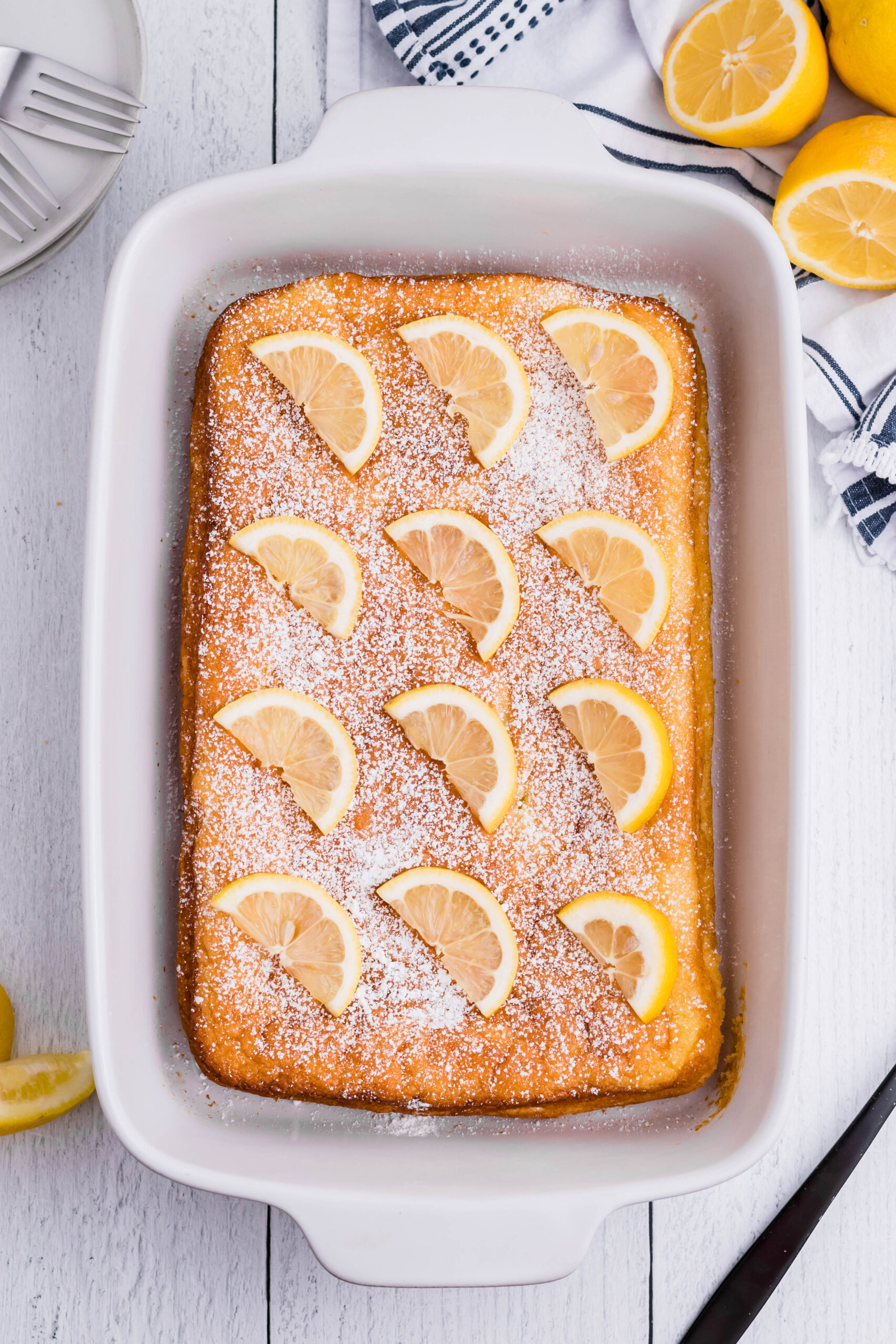 2 Ingredient Lemon Bars uncut in a white baking pan overhead shot