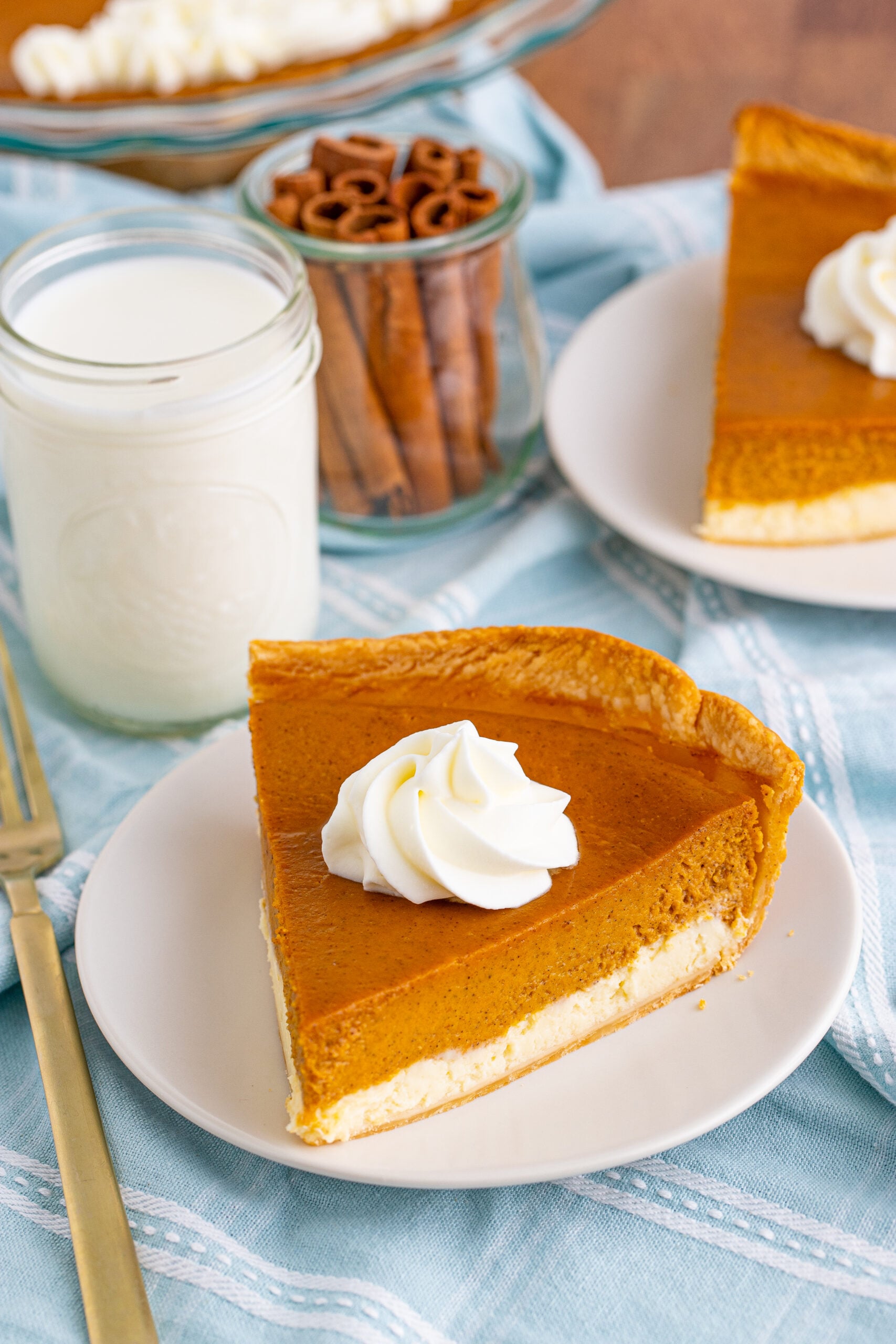 Pumpkin Pie Cheesecake slice on a white plate overhead angle