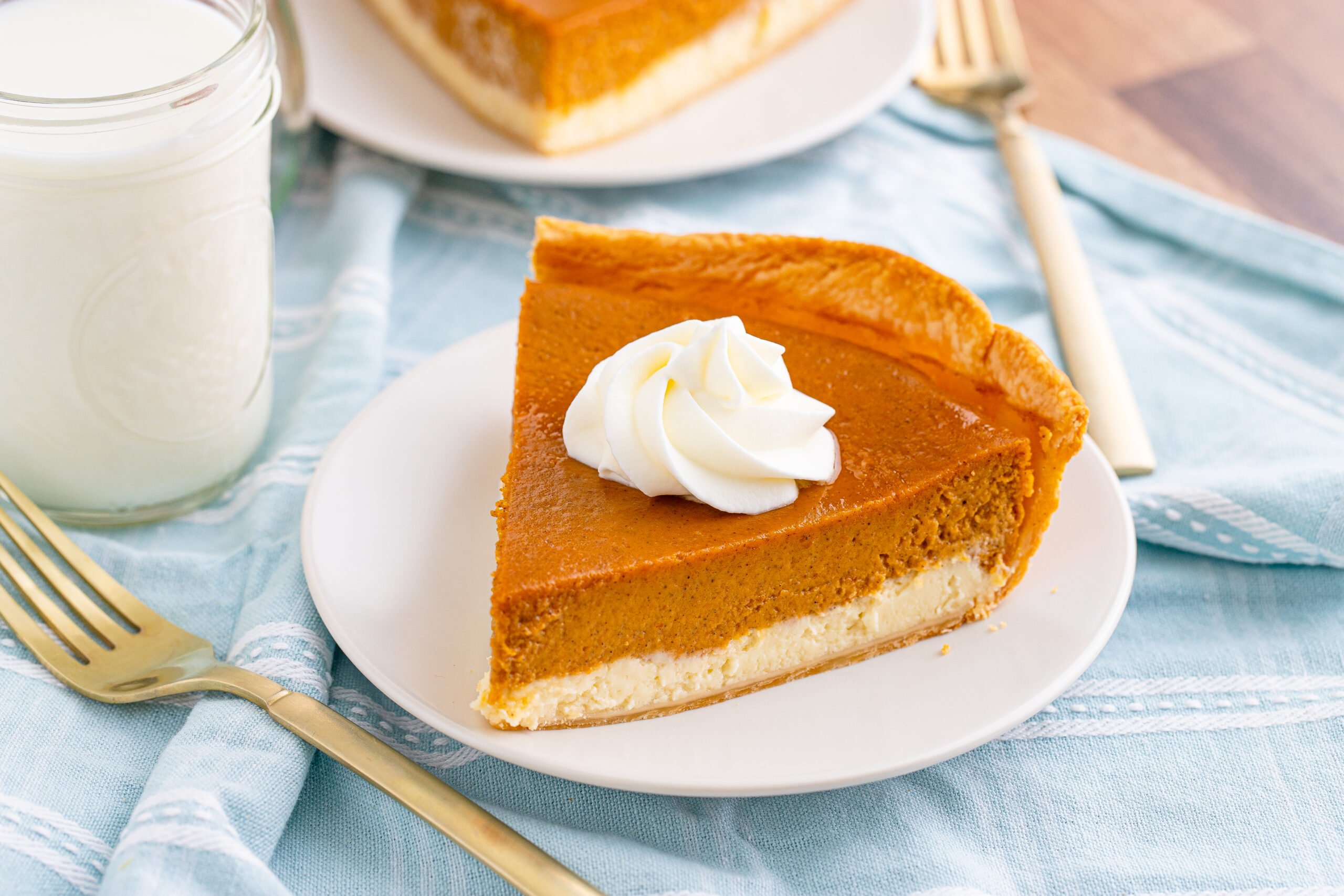 Pumpkin Pie Cheesecake slice on a white plate side angle