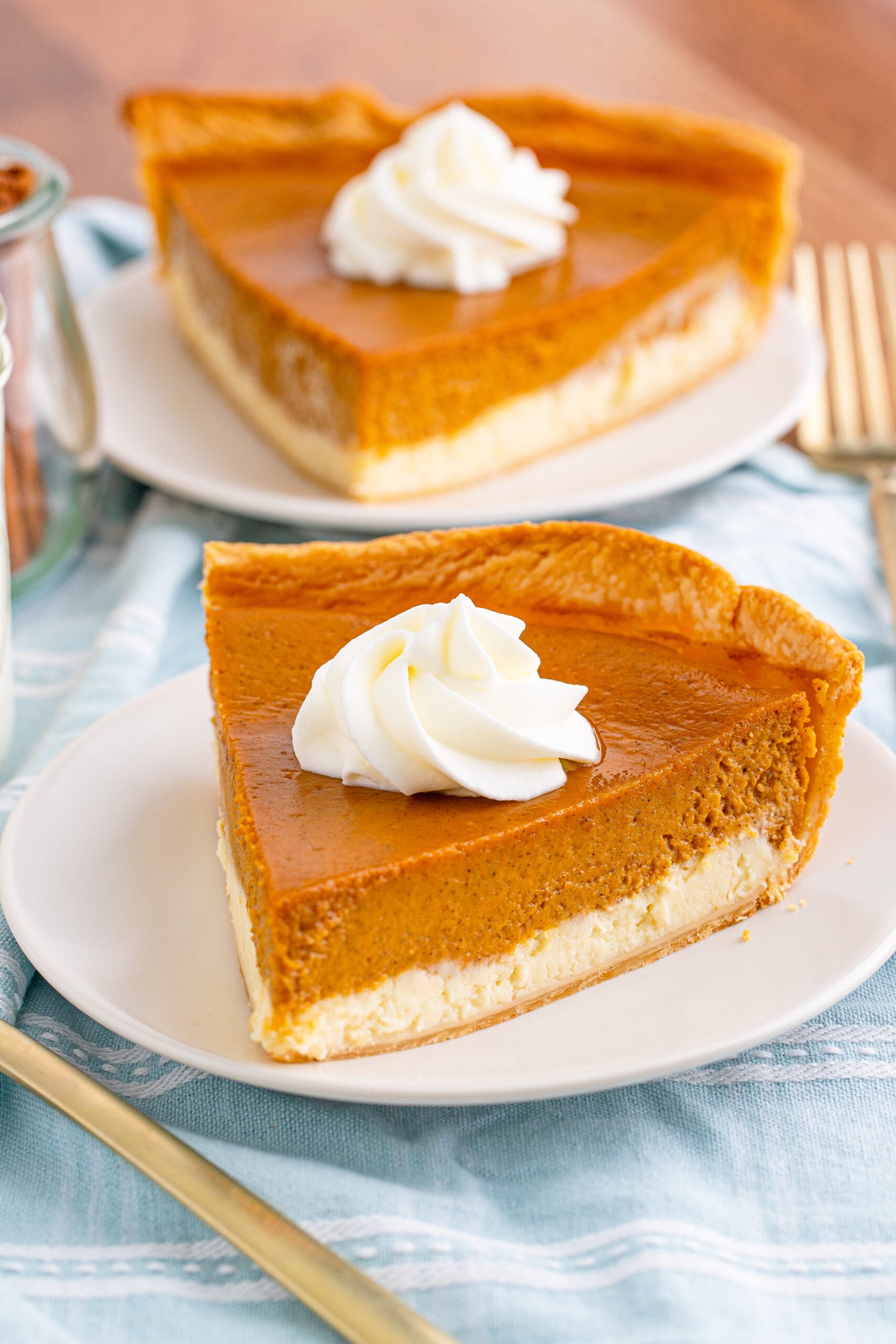 Pumpkin Pie Cheesecake slice on a white plate