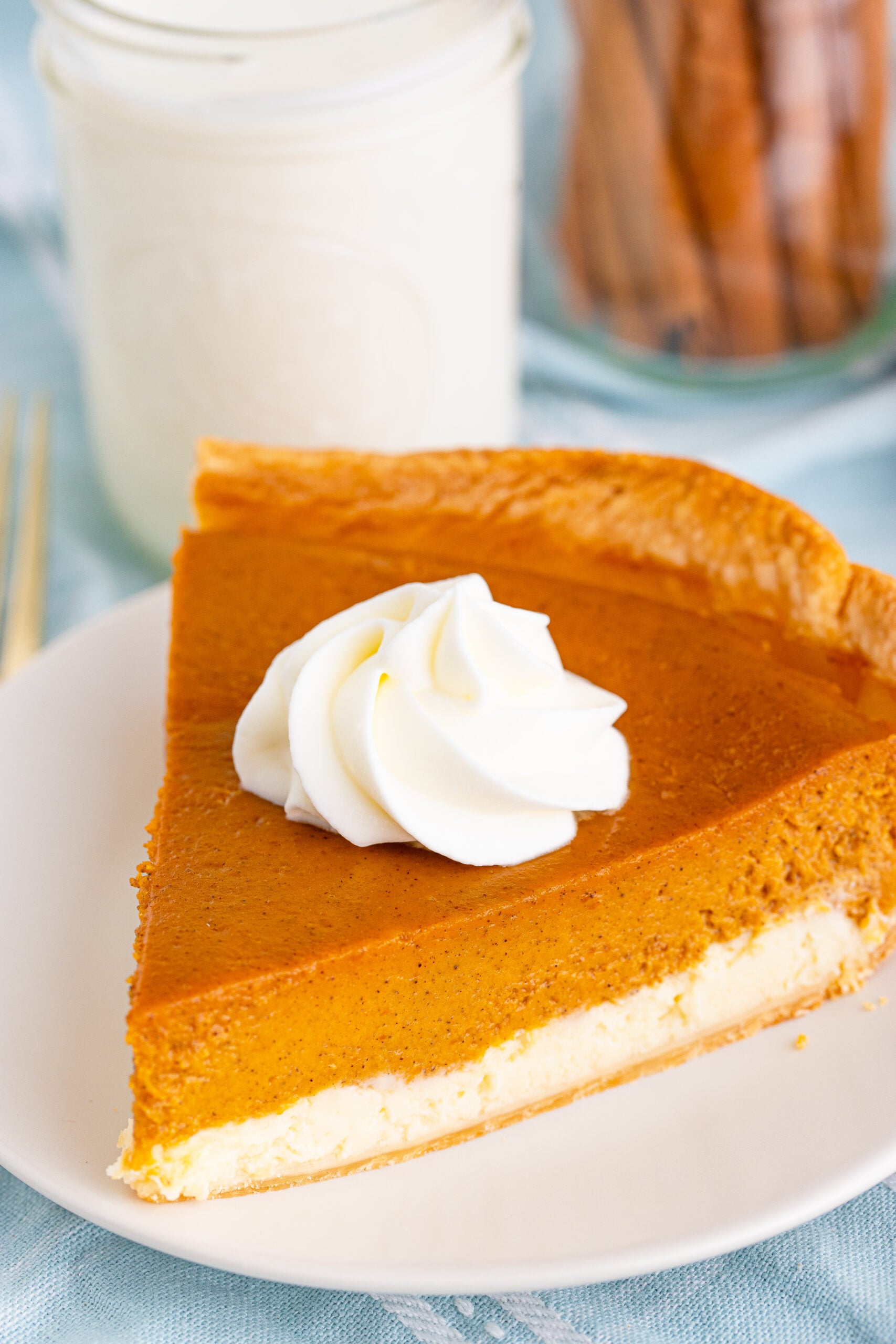Pumpkin Pie Cheesecake slice on a white plate