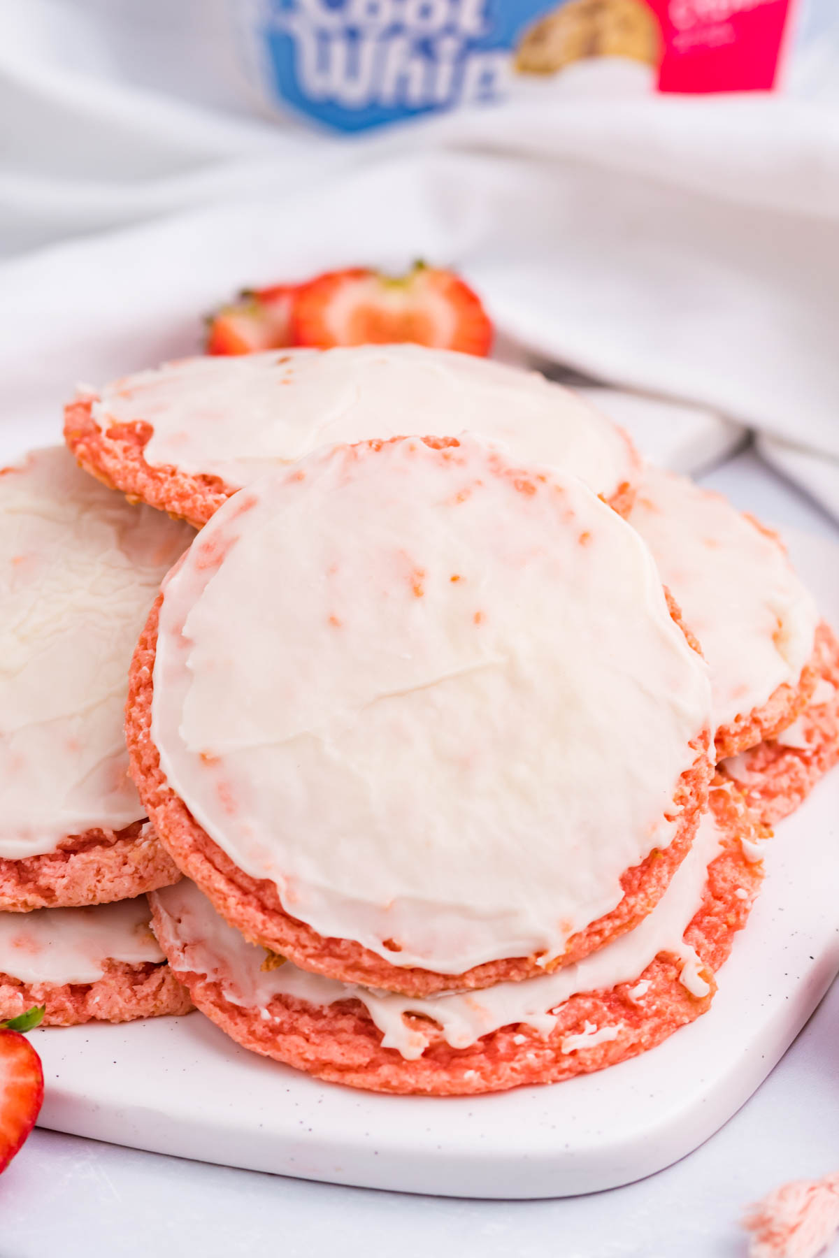 Strawberry Cool Whip Cookies piled on a white plate