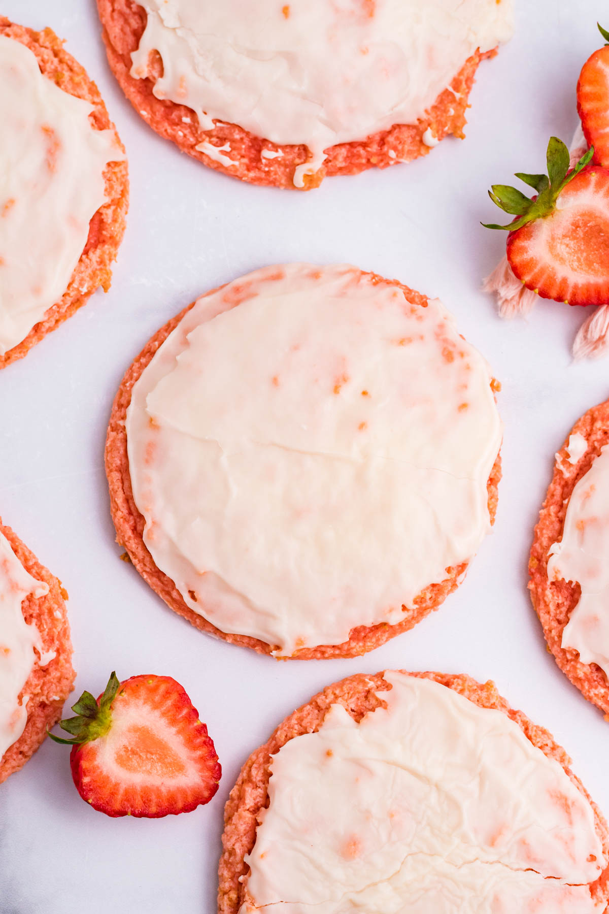 Strawberry Cool Whip Cookies overhead shot surrounded by sliced strawberries
