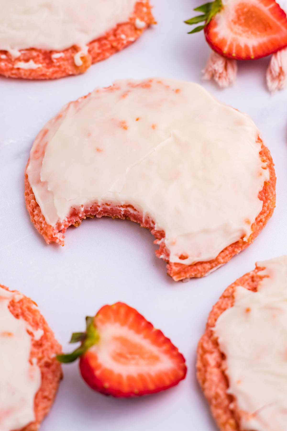 Strawberry Cool Whip Cookie overhead angle with a bite missing