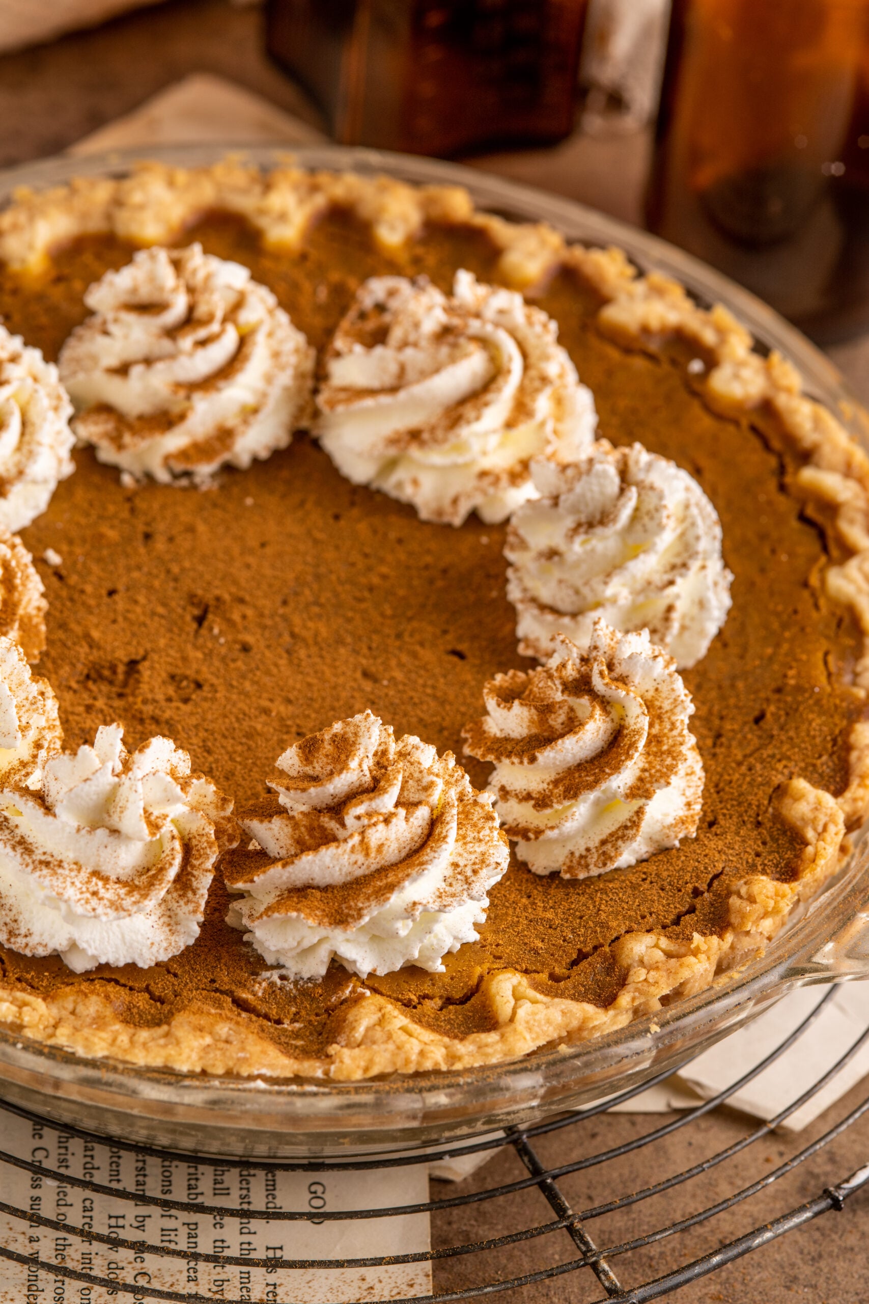 Pumpkin Custard Pie topped with dollops of whipped cream