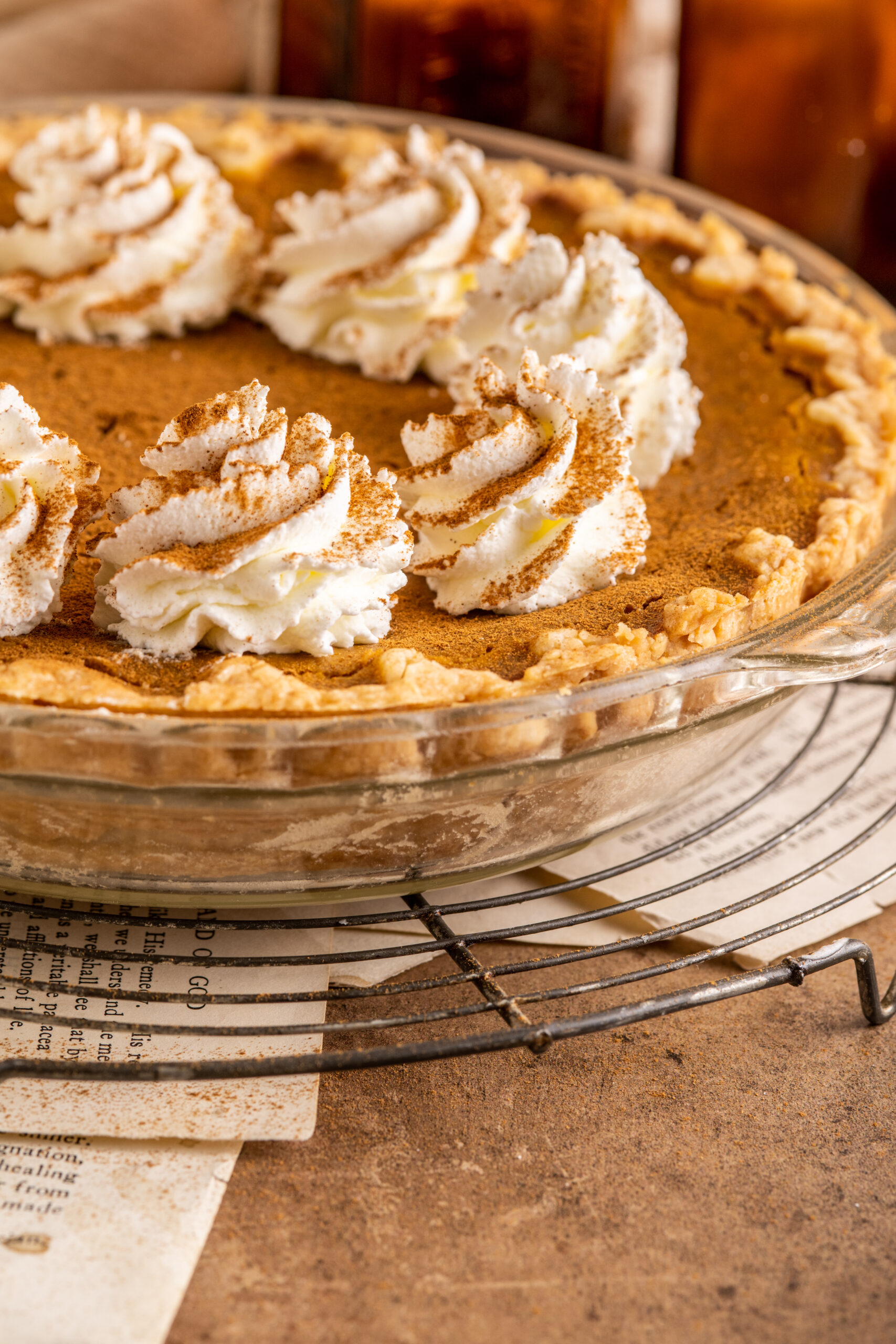 Pumpkin Custard Pie uncut in a clear pie dish