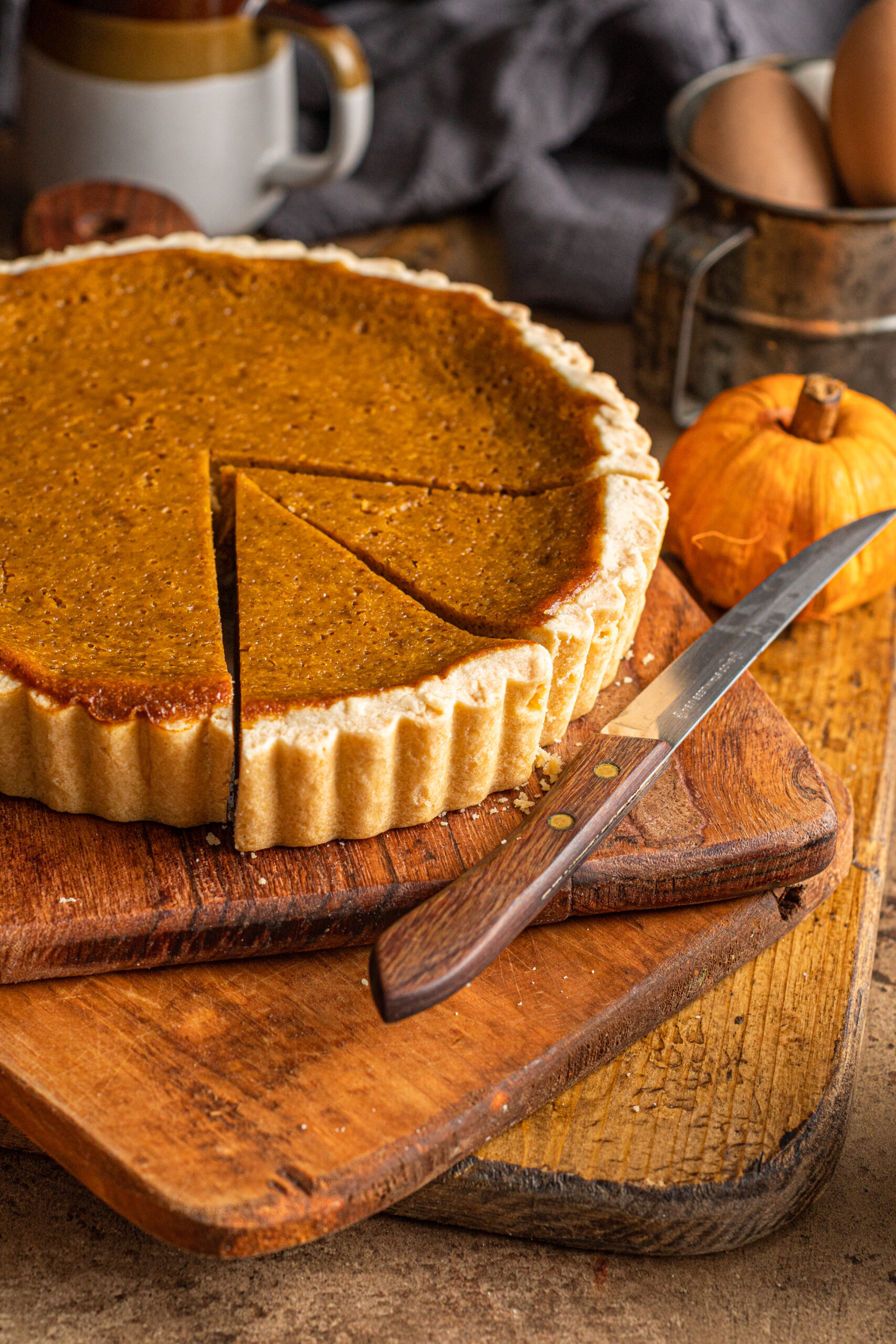 Pumpkin Pie Tart on three wooden cutting boards