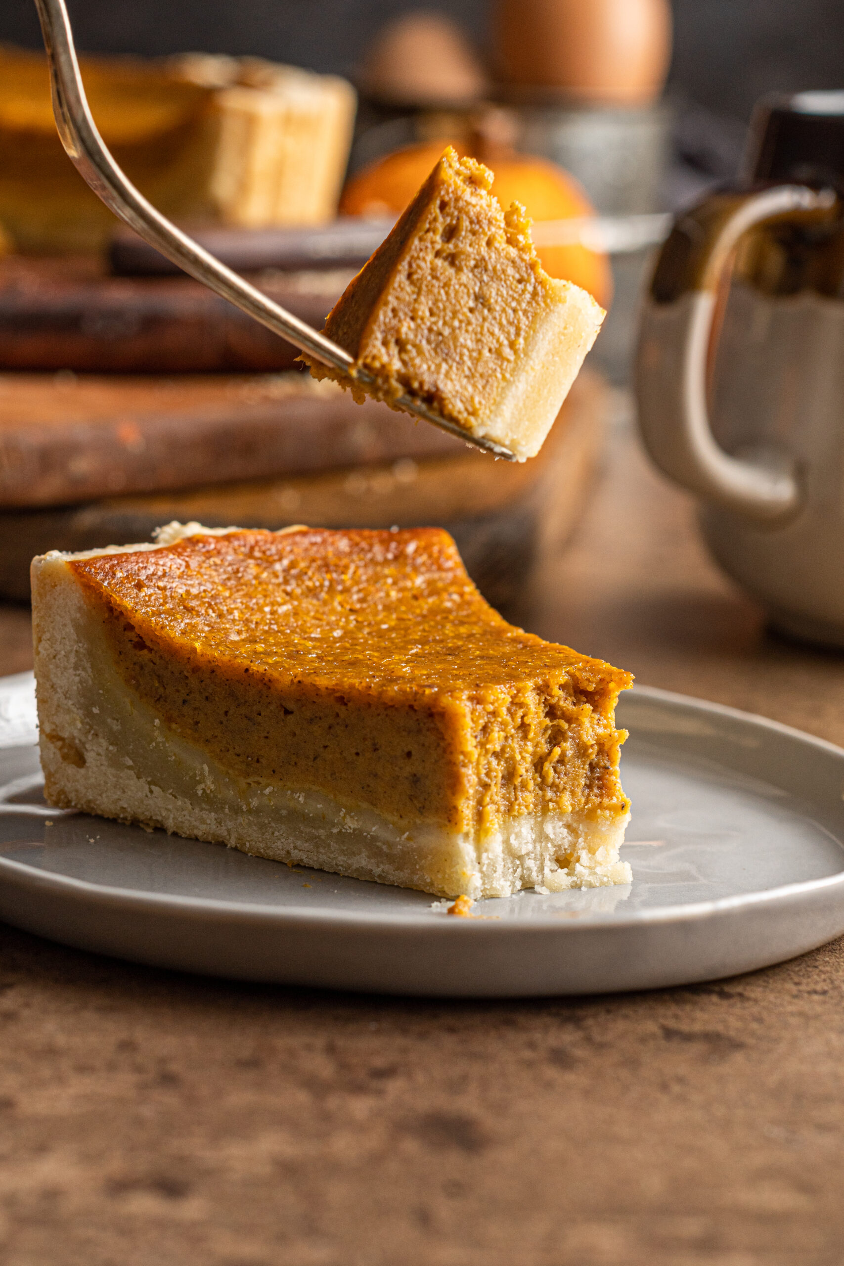 Pumpkin Pie Tart with a fork lifting a bite up