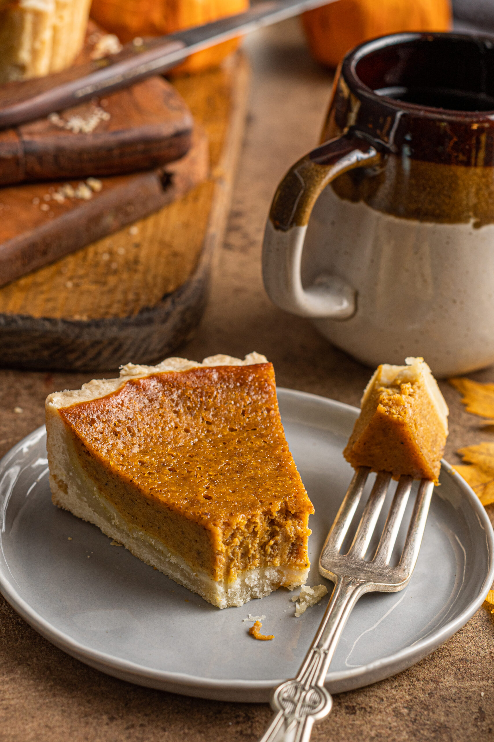 Pumpkin Pie Tart on a gray plate with a bite missing