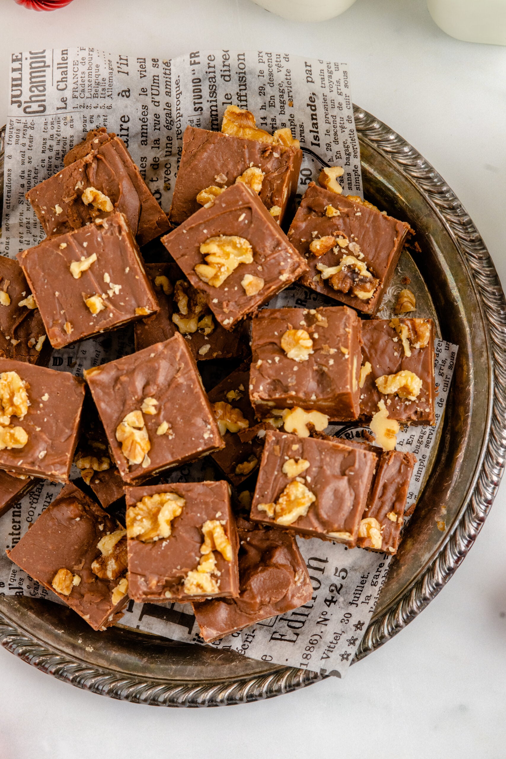 Overhead shot of the fudge stacked on a tin serving tray.