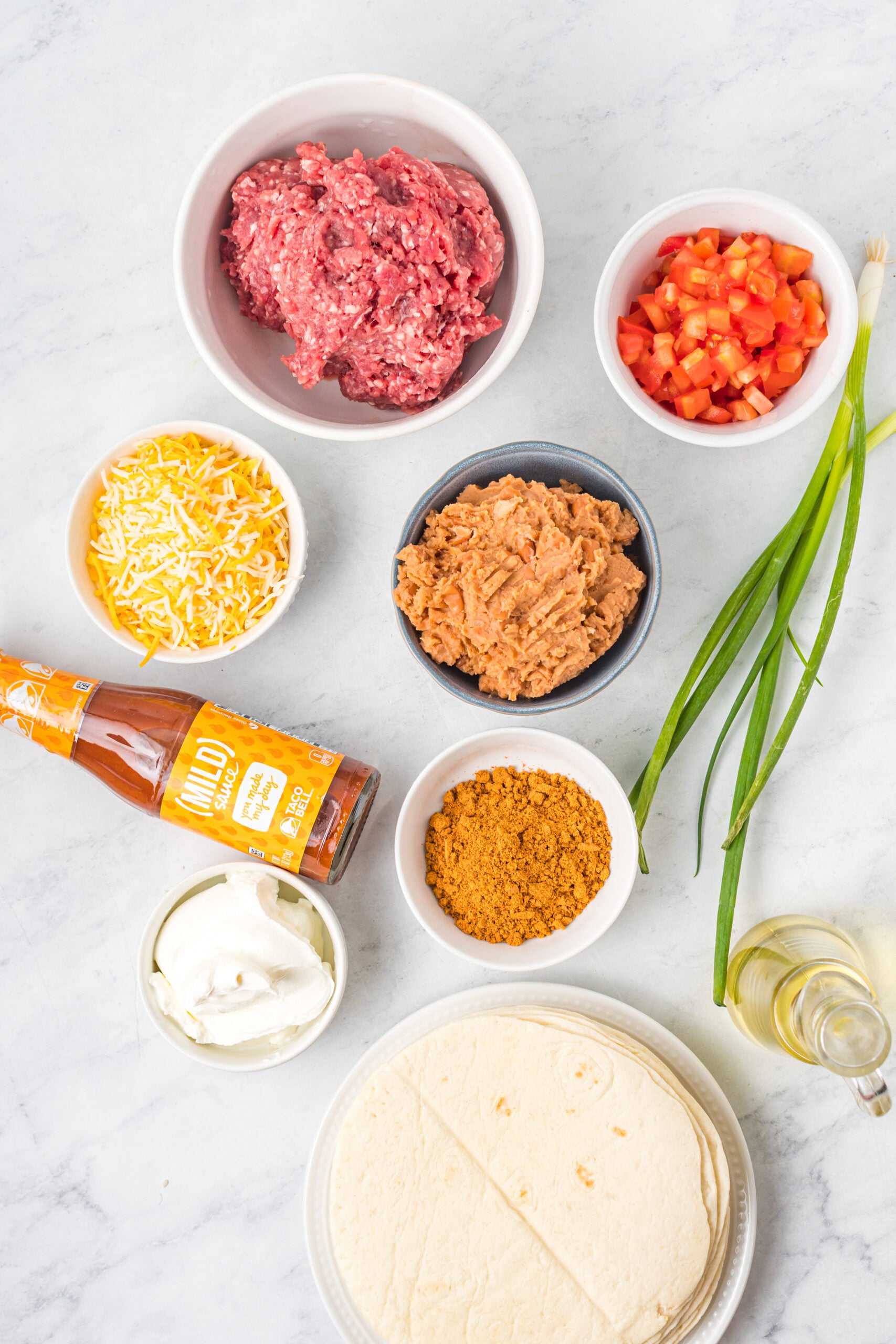 Overhead shot of ingredients needed to make Taco Bell Mexican Pizza.