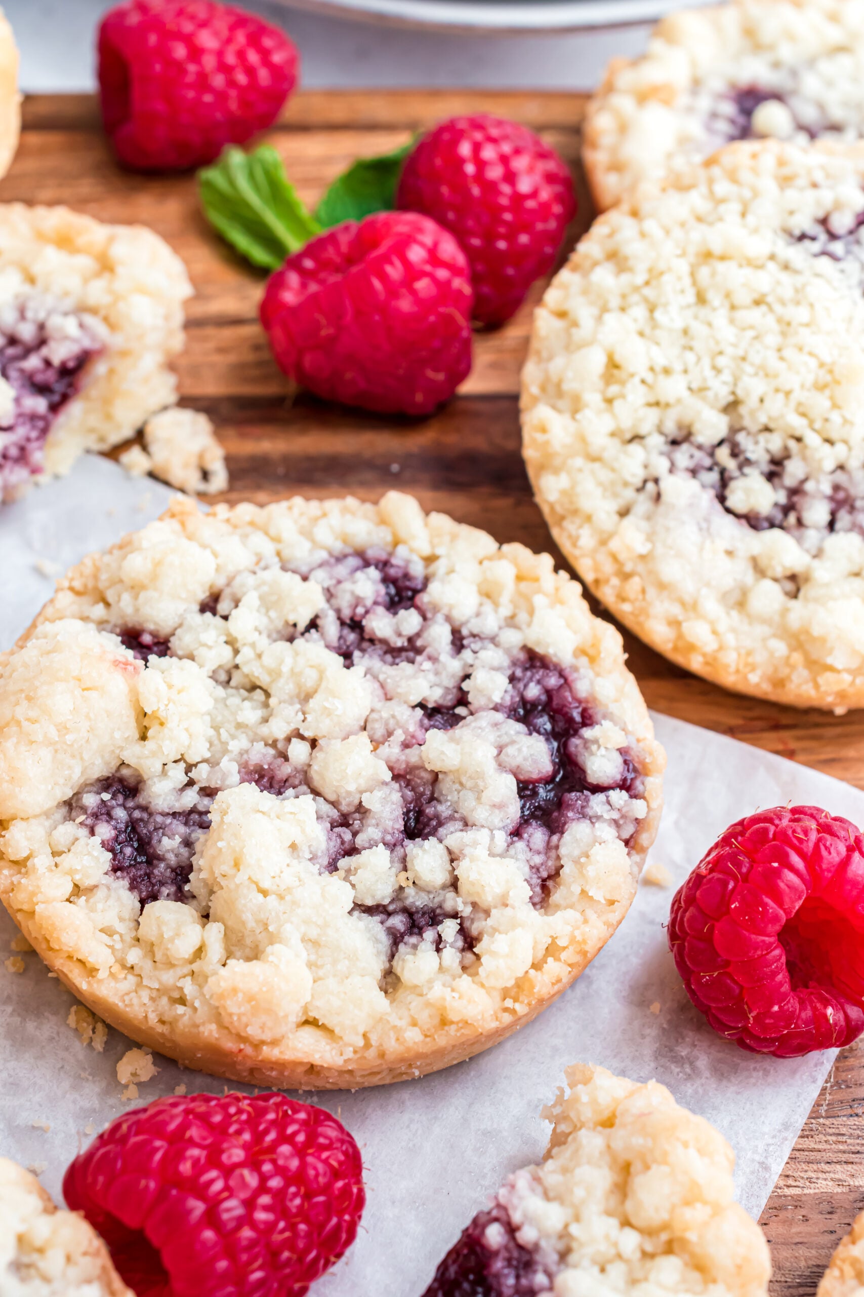 Raspberry cookies on a wooden cutting board