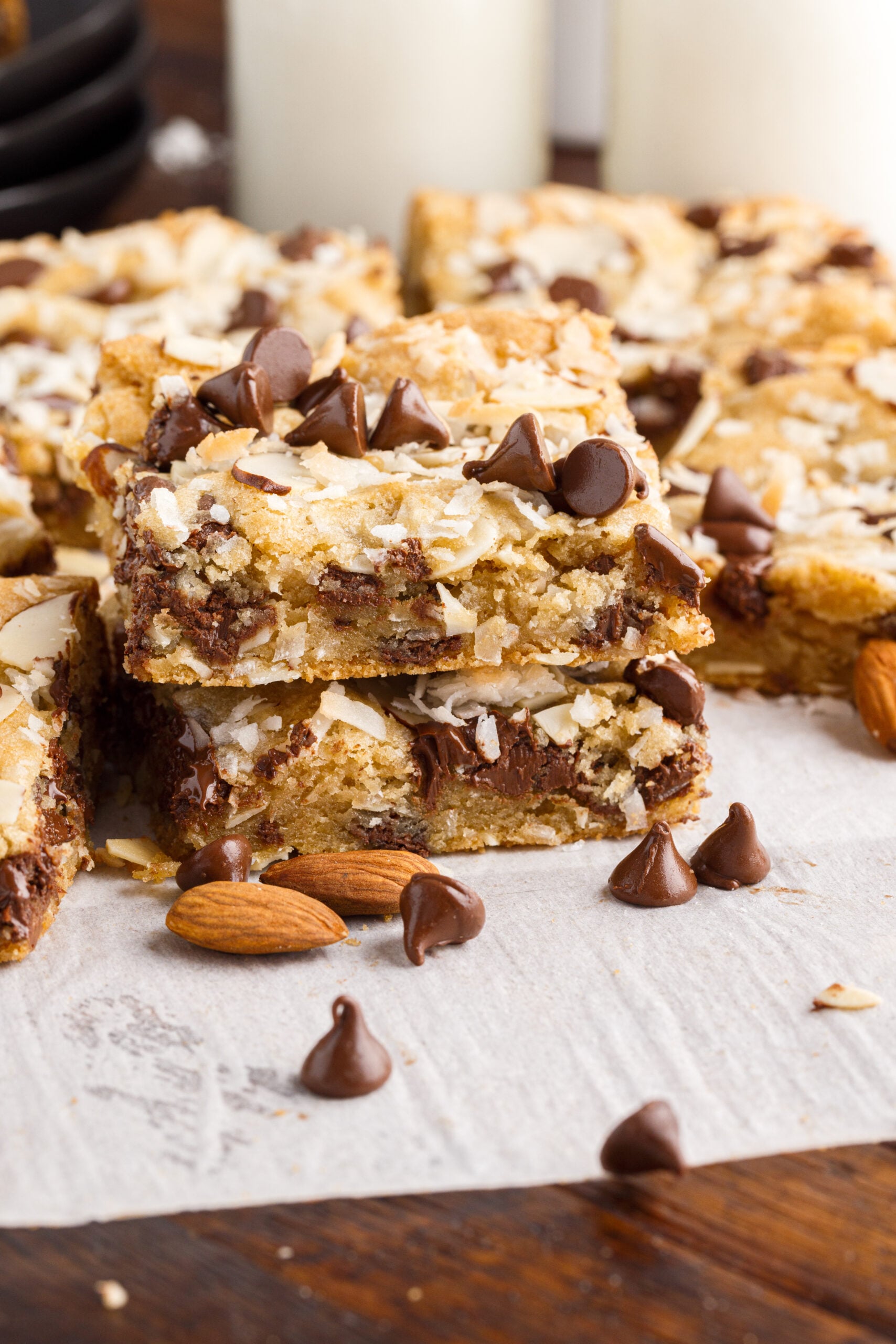 two bars stacked on top of each other topped with chocolate chips and almonds.