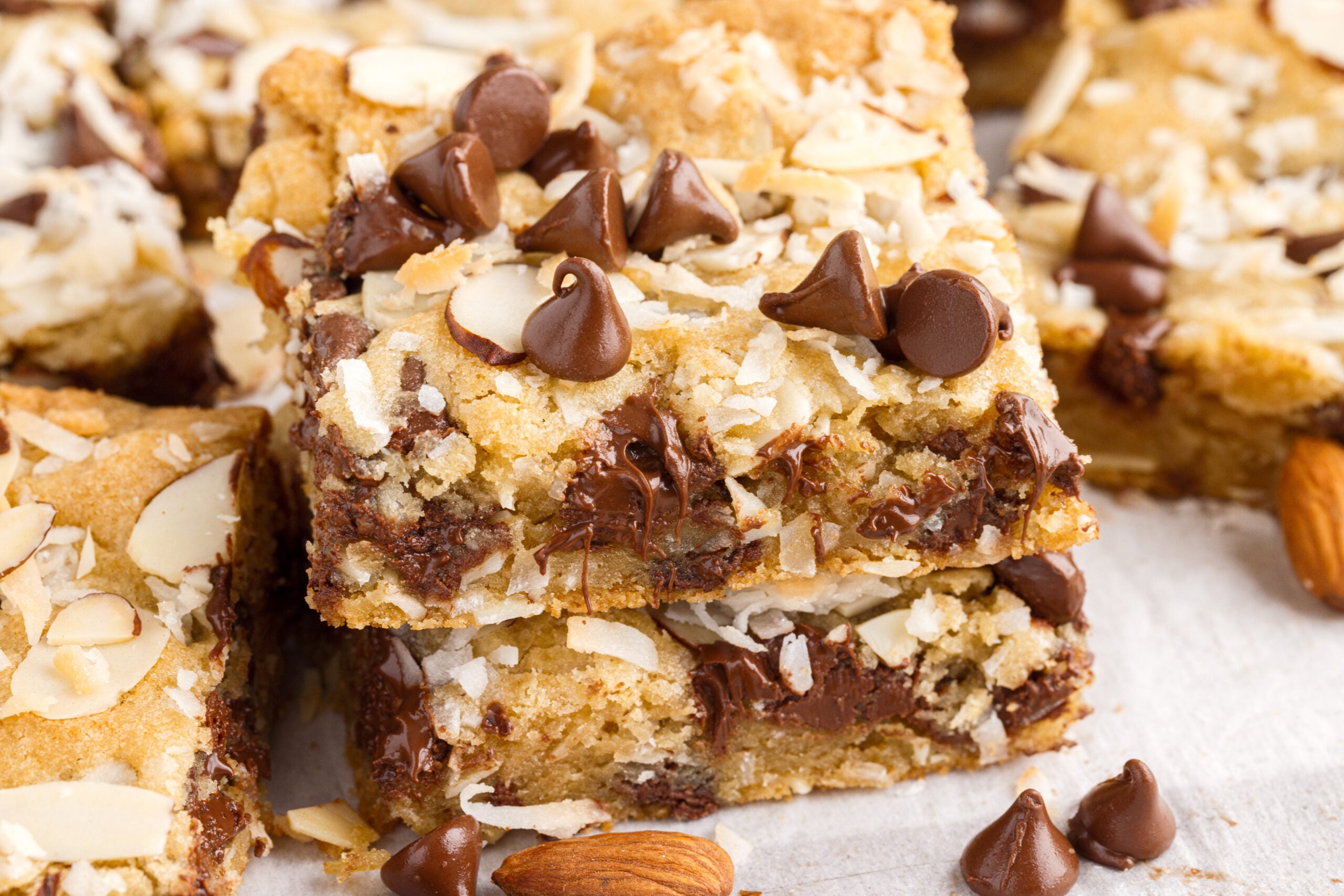 two bars stacked on top of each other topped with chocolate chips and almonds.