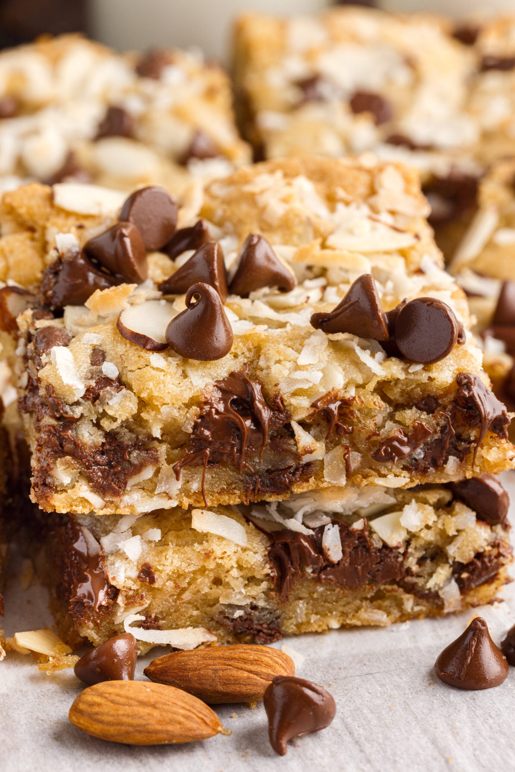 two bars stacked on top of each other topped with chocolate chips and almonds.