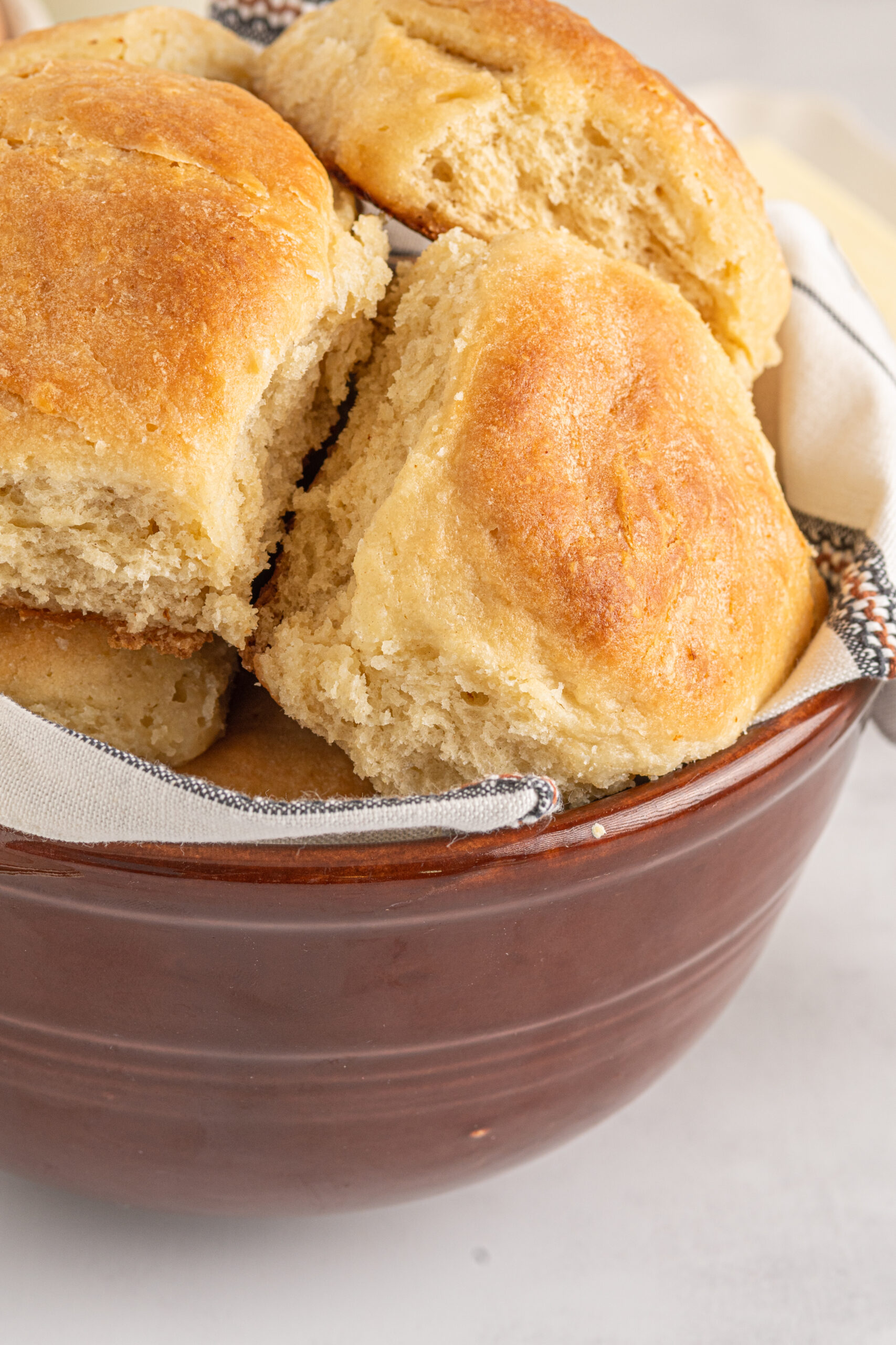 angel biscuits up close in a wood bowl to show texture