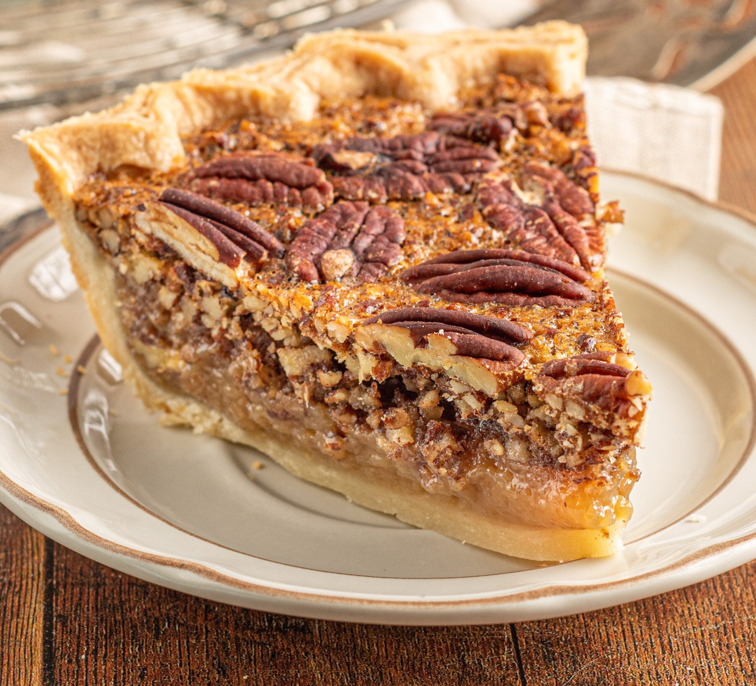 Pecan pie on a cream colored plate