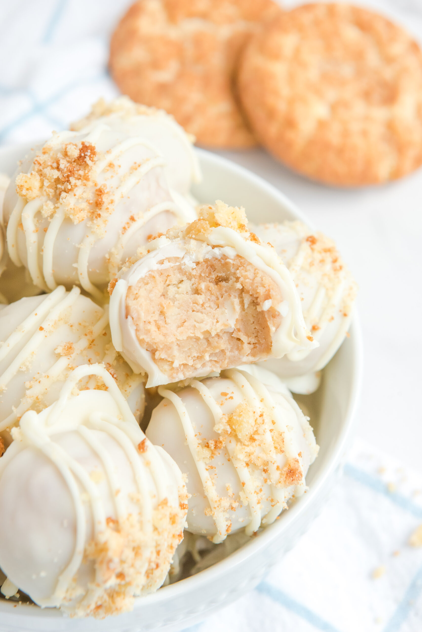 Close up of the crushed snickerdoodle topping on the truffles. One with a bite missing