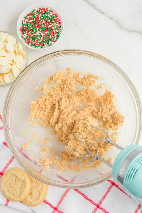 Overhead shot of the ingredients being mixed in a glass mixing bowl.