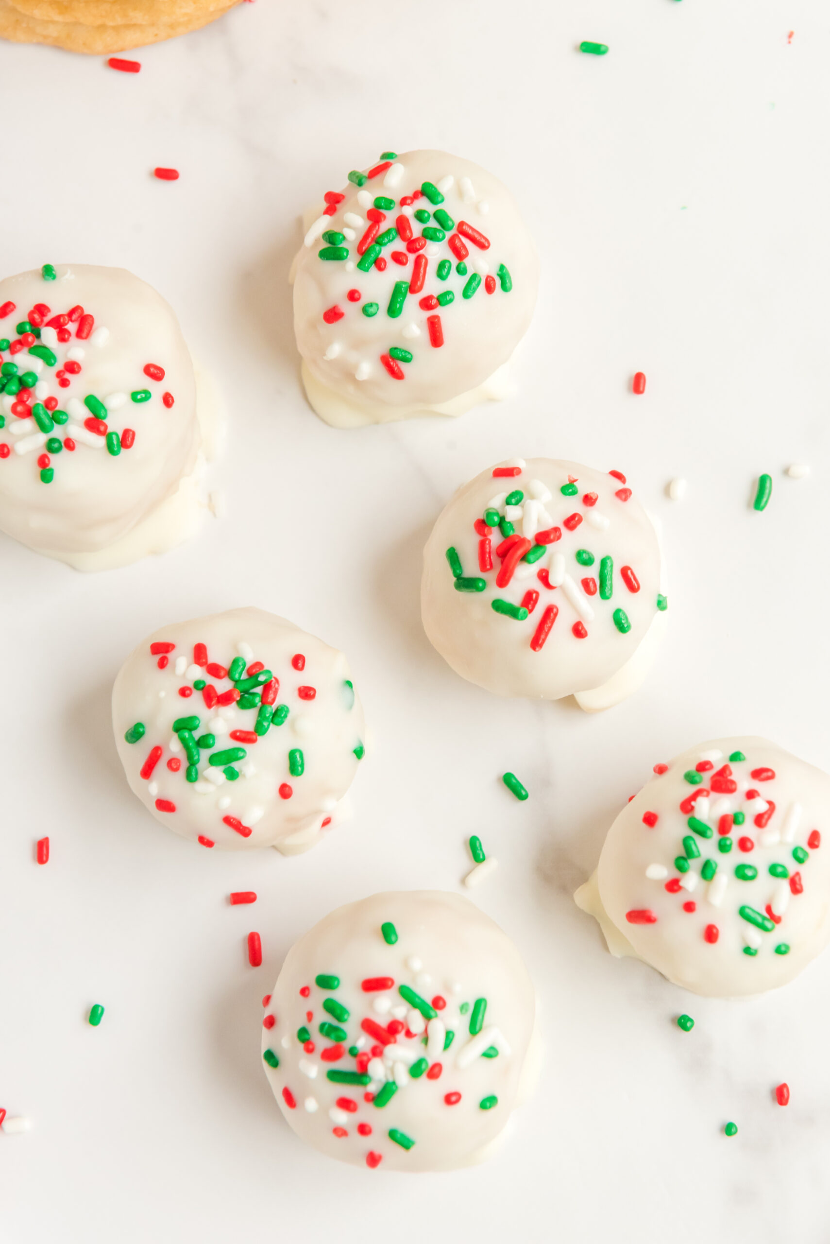 Overhead view of the finished truffles topped with red, green, and white sprinkles.