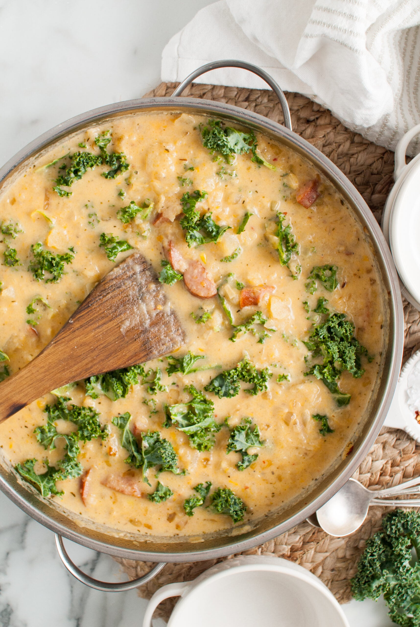 Overhead shot of Kielbasa Potato soup in a silver skillet. 