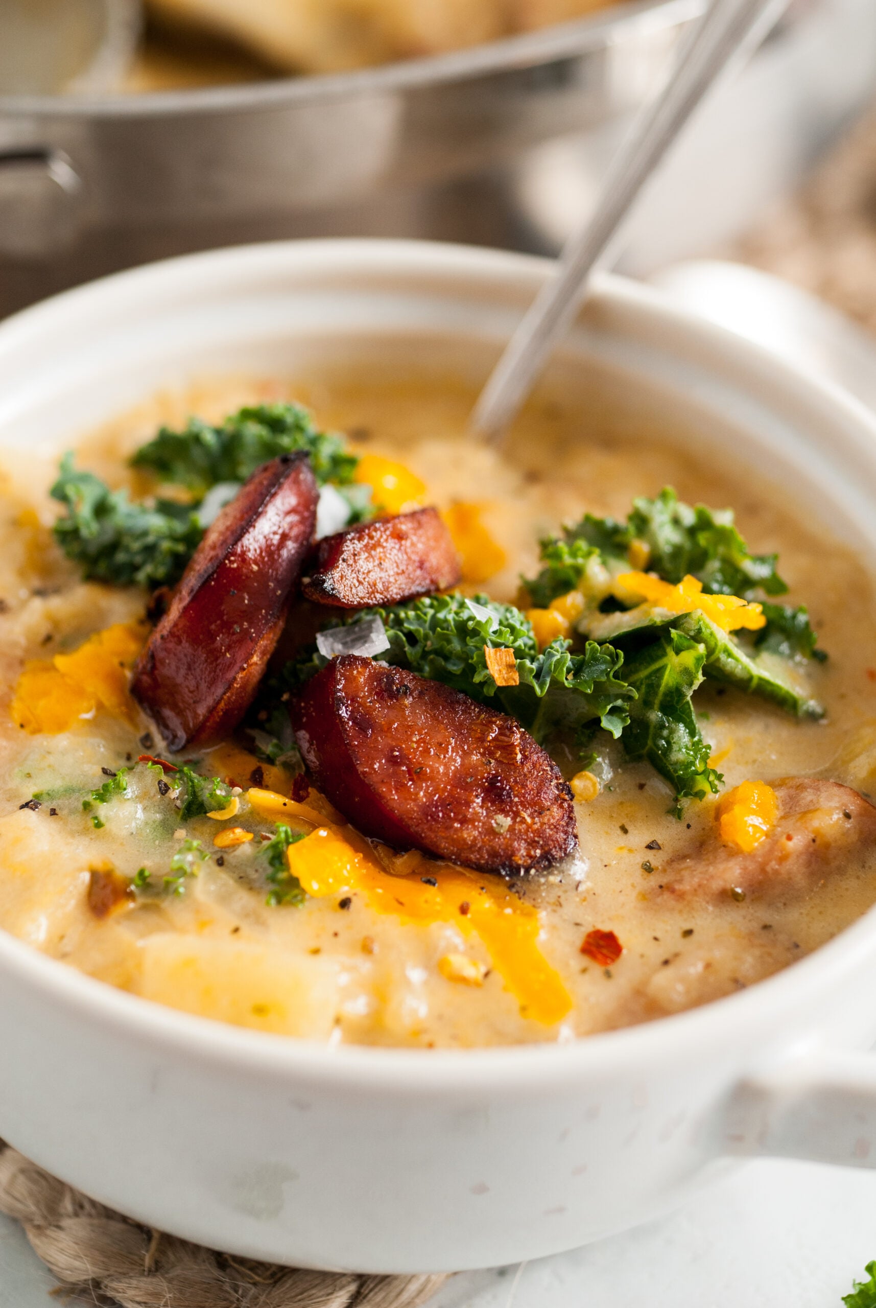 Close up shot of the soup topped with cheese