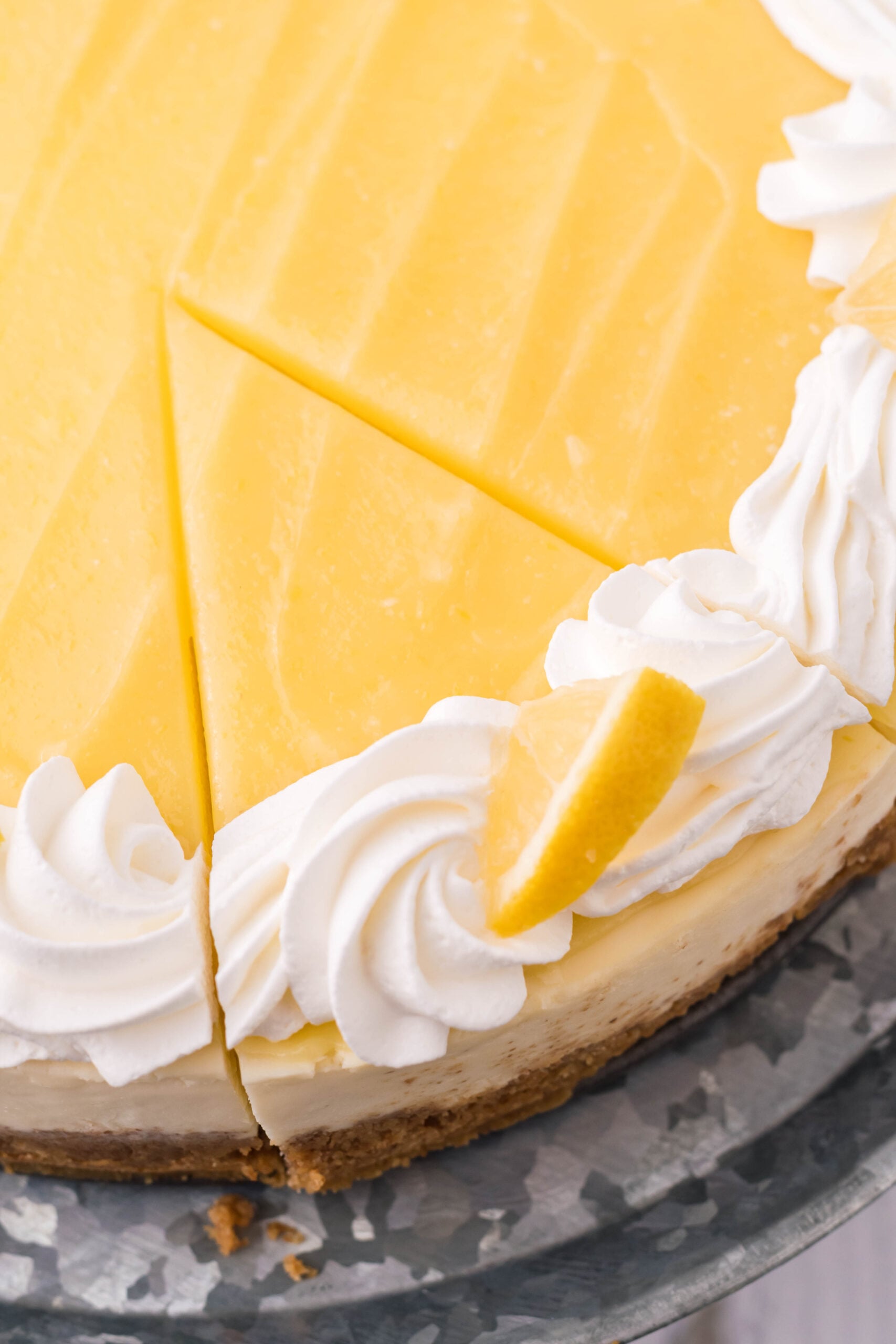An overhead view of a slice of Lemon Curd Cheesecake.