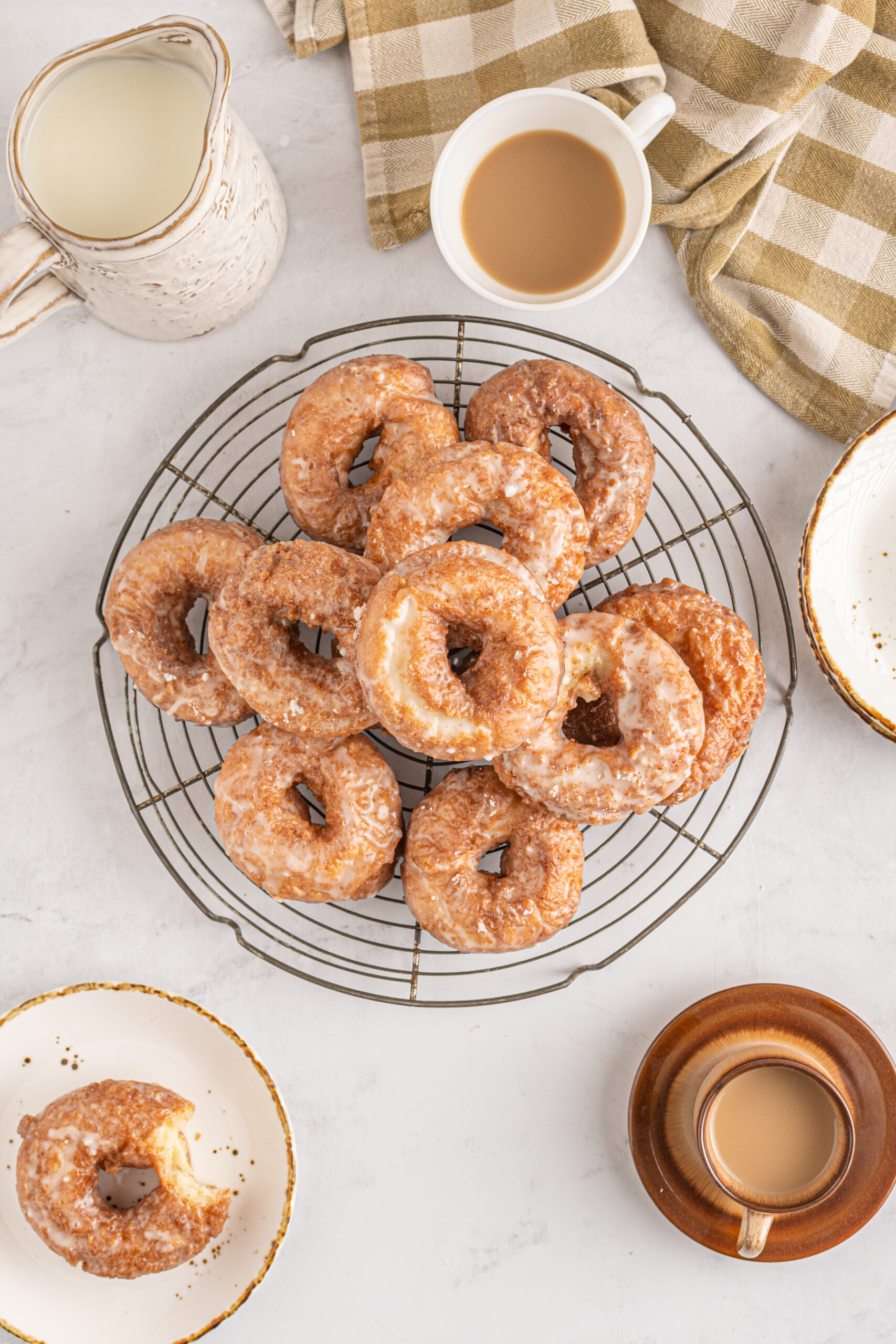 Overhead view of the old fashioned donuts on a wire rack.