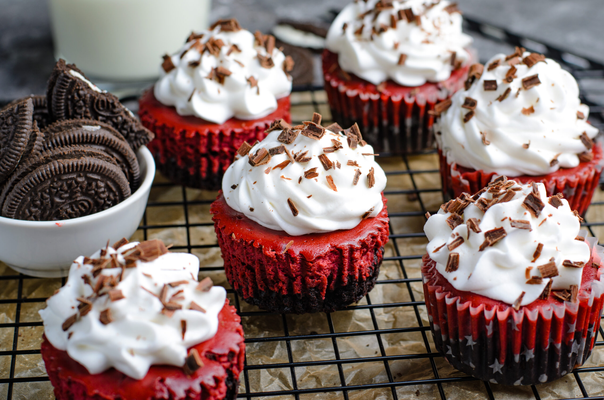  Mini Red Velvet Oreo Cheesecakes on a wire rack 