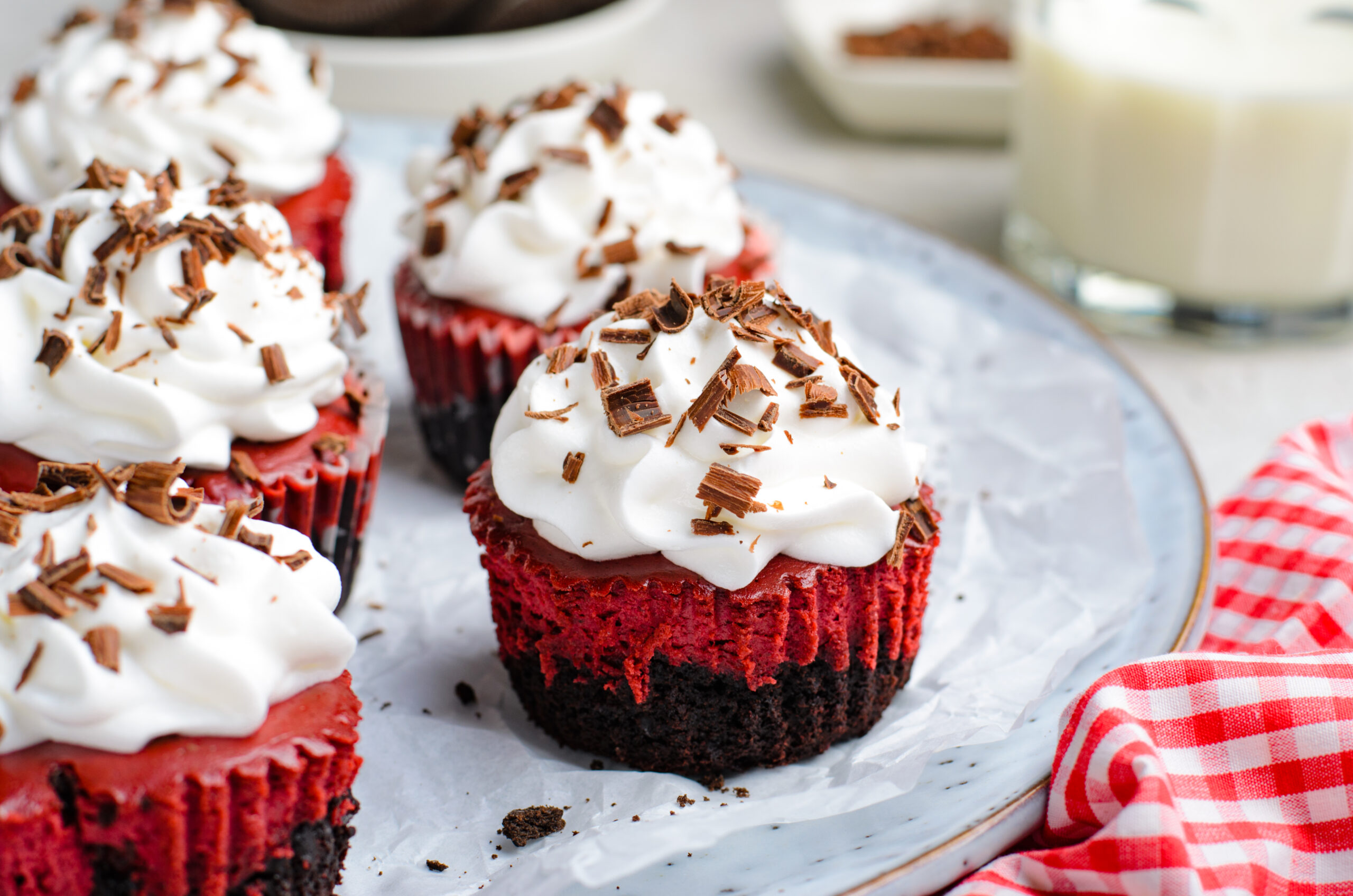 side view of the Mini Red Velvet Oreo Cheesecakes on a platter