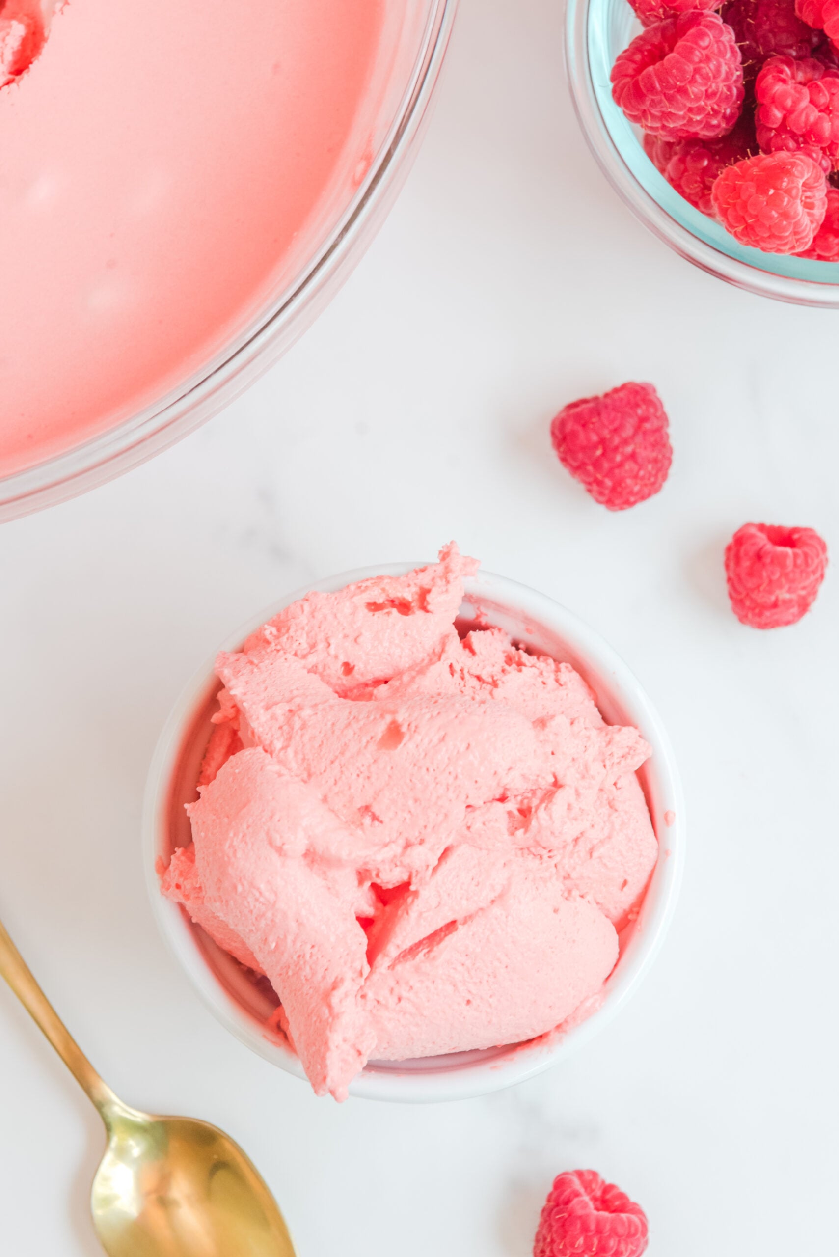Overhead view of Raspberry Jello Fluff in a white dish.
