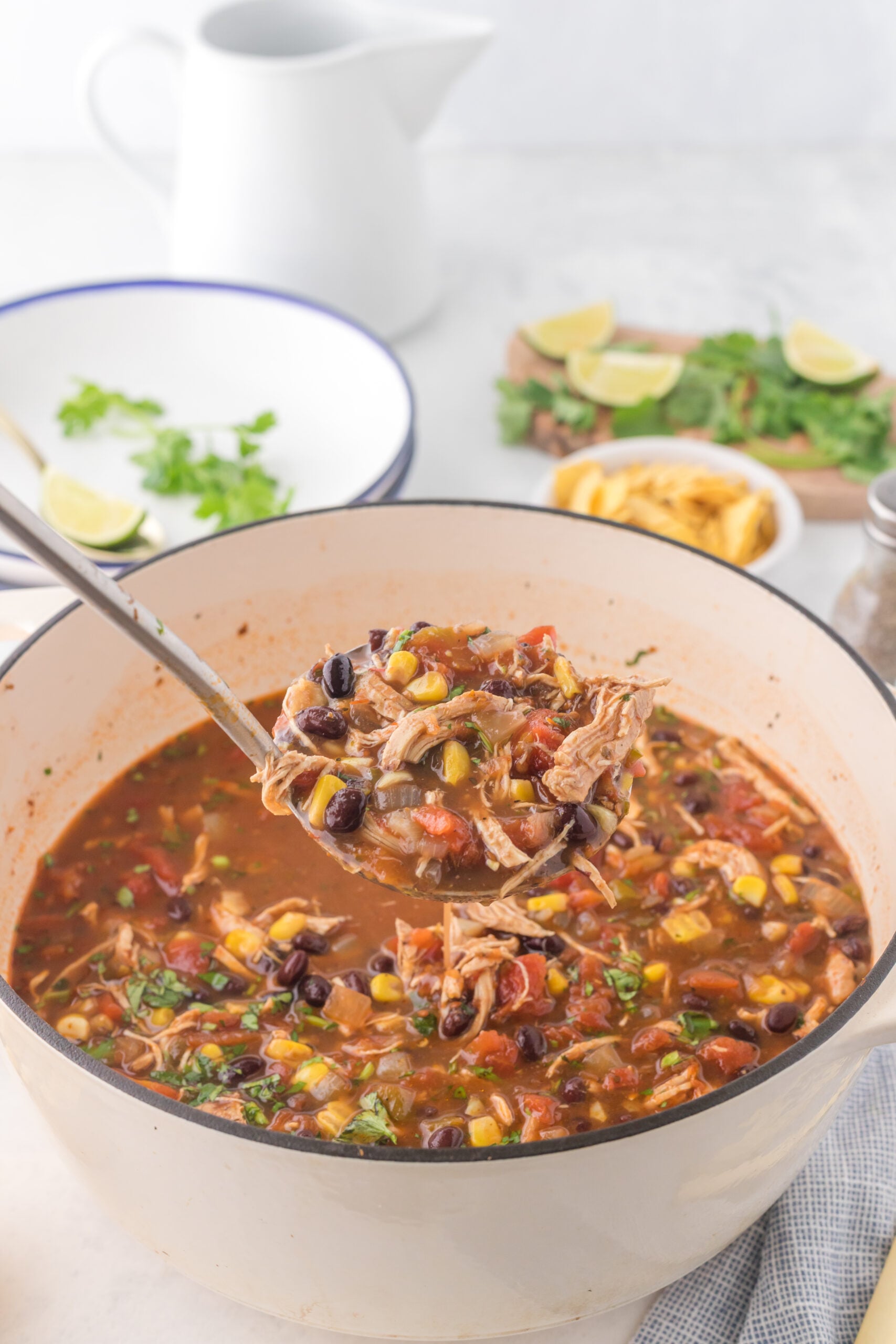 Chicken Taco Soup in a silver serving spoon.