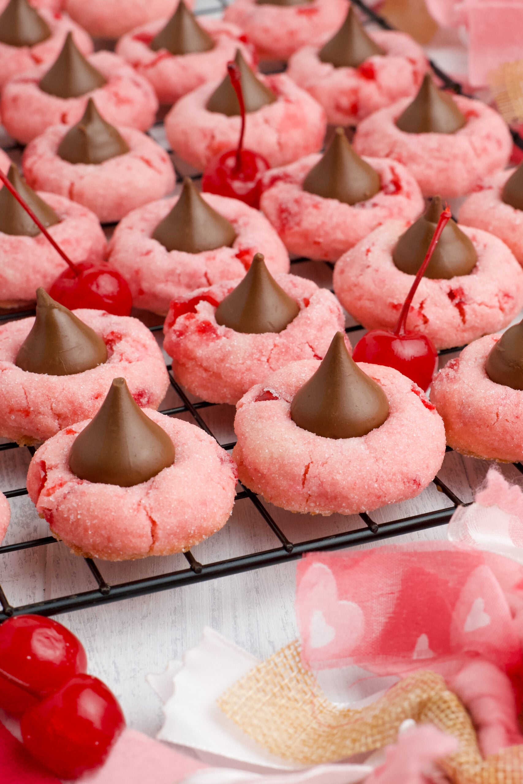 Front view of Cherry Blossom Cookies on a black wire rack.