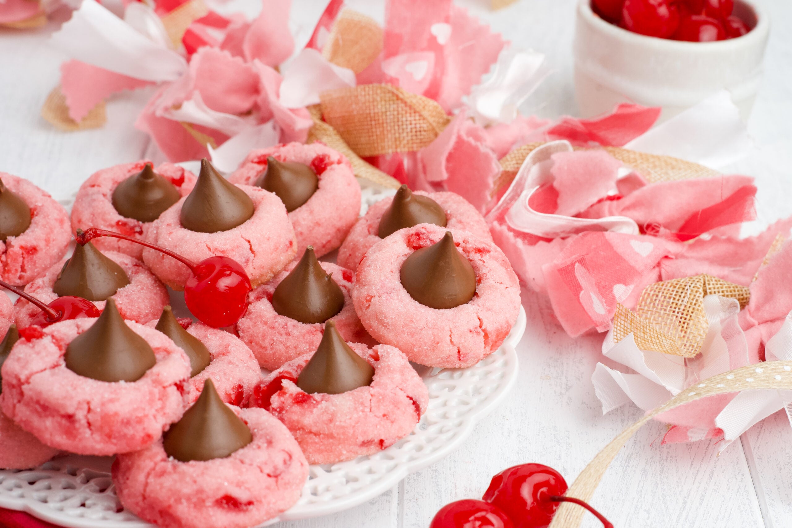 Front view of Cherry Blossom Cookies on a white dish.