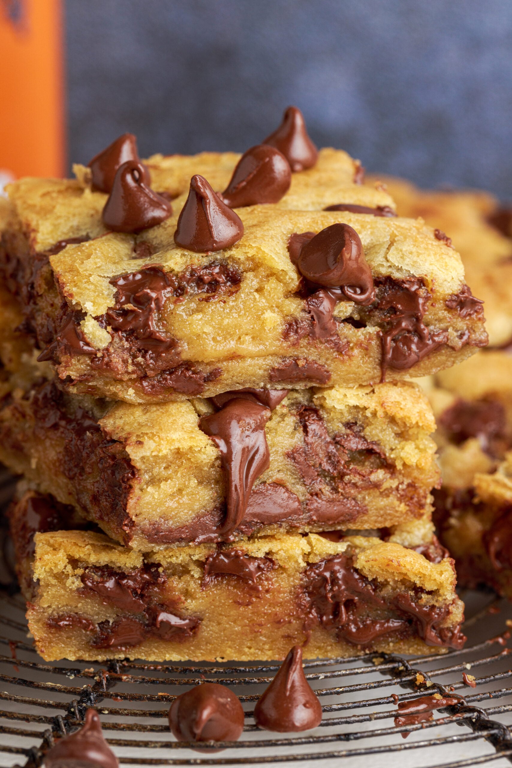 Side view of three stacked chocolate chip cookie bars.