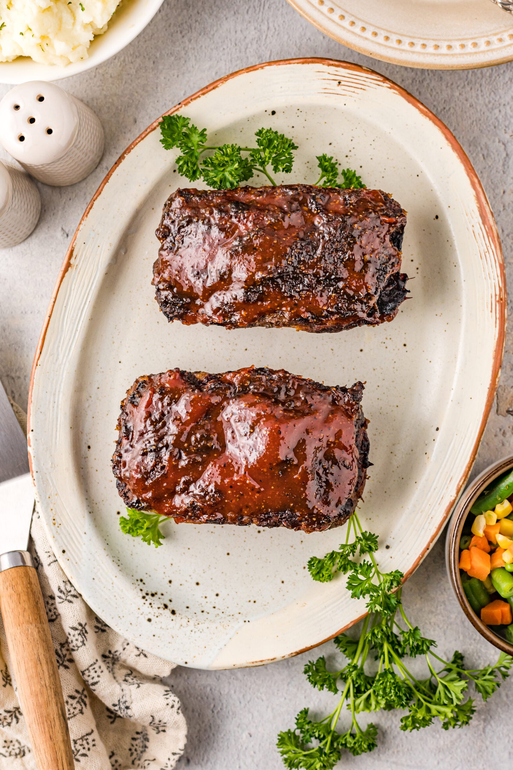 Overhead view of Cracker Barrel Meatloaf on a serving dish.