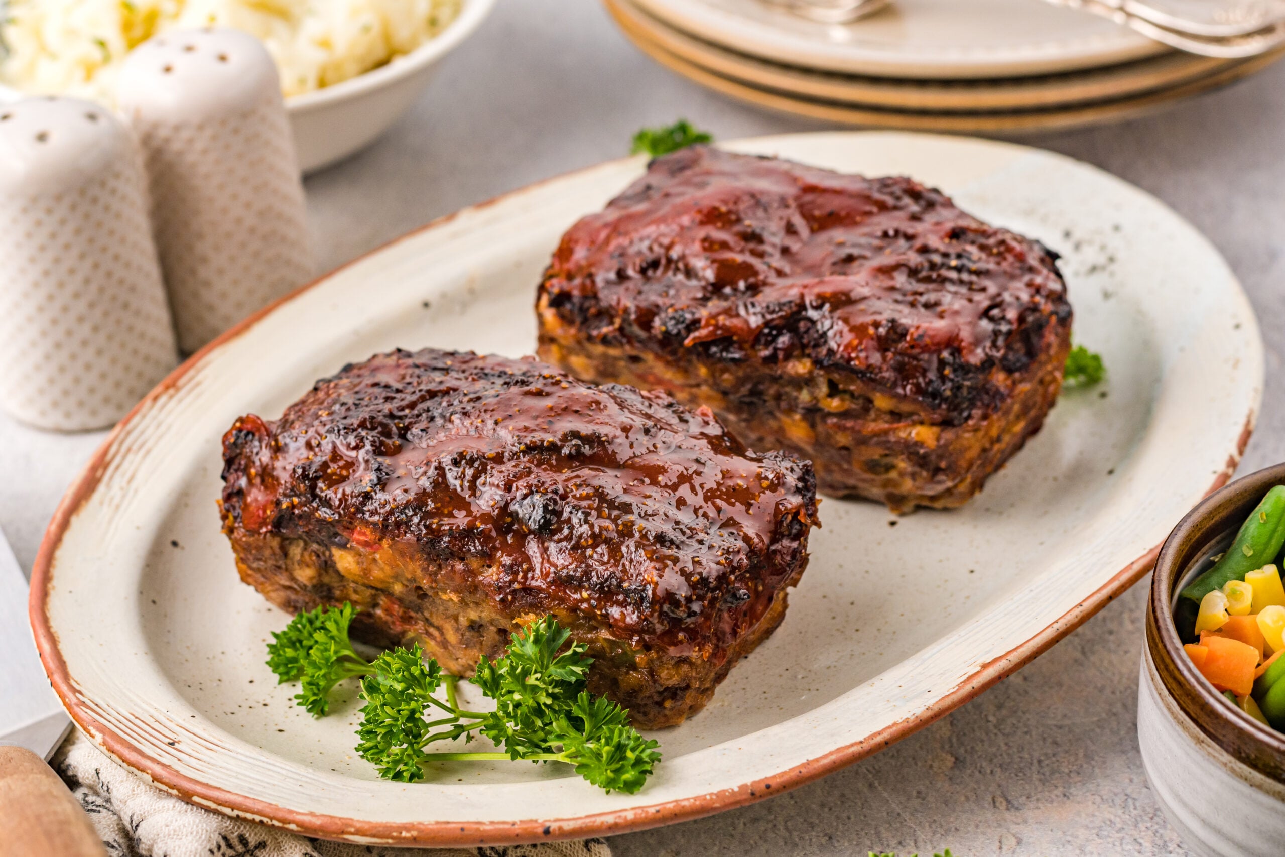 Side view of Cracker Barrel Meatloaf on a serving dish.