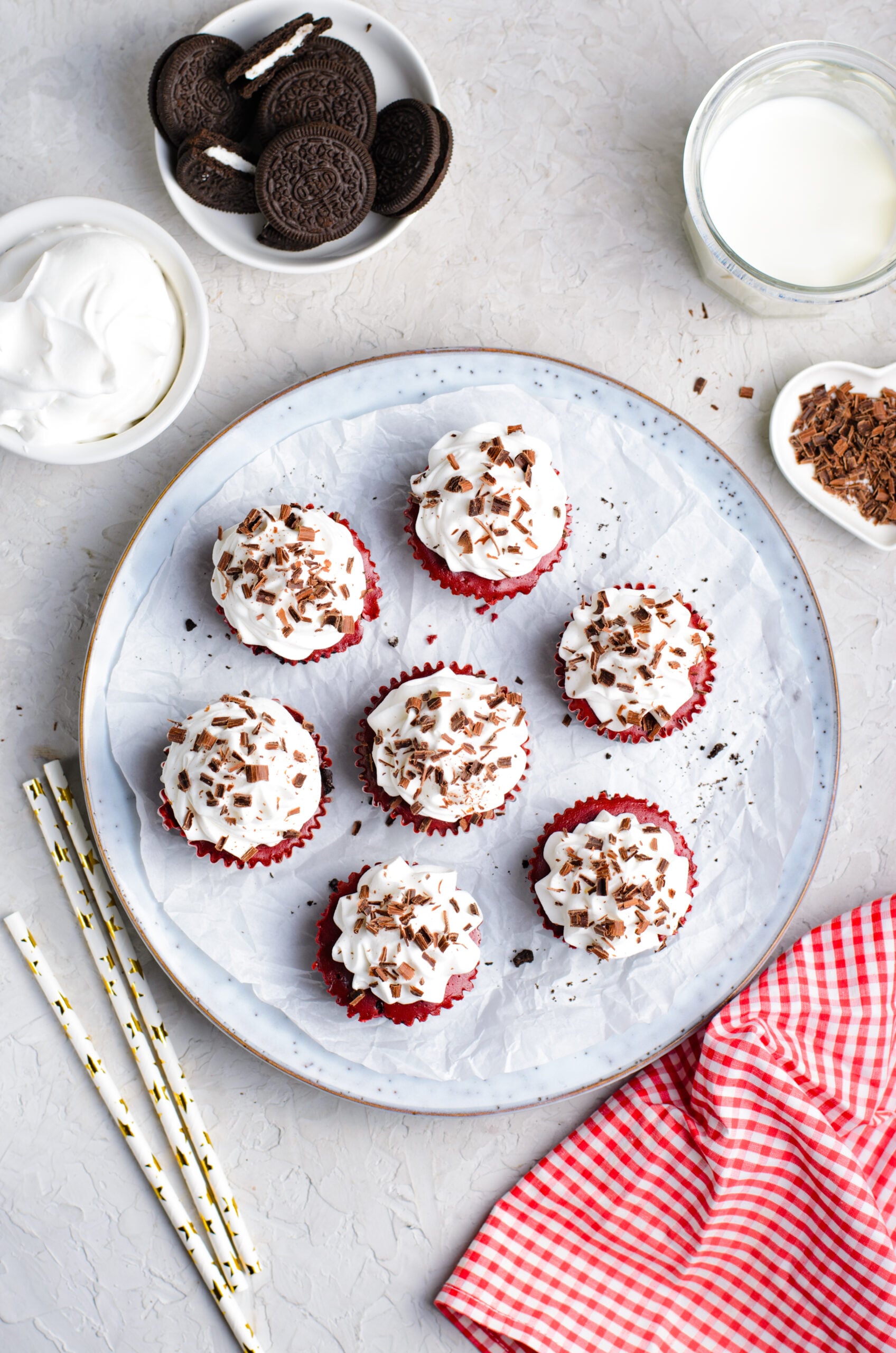 Overhead view of Mini Red Velvet Oreo Cheesecakes on a dish.