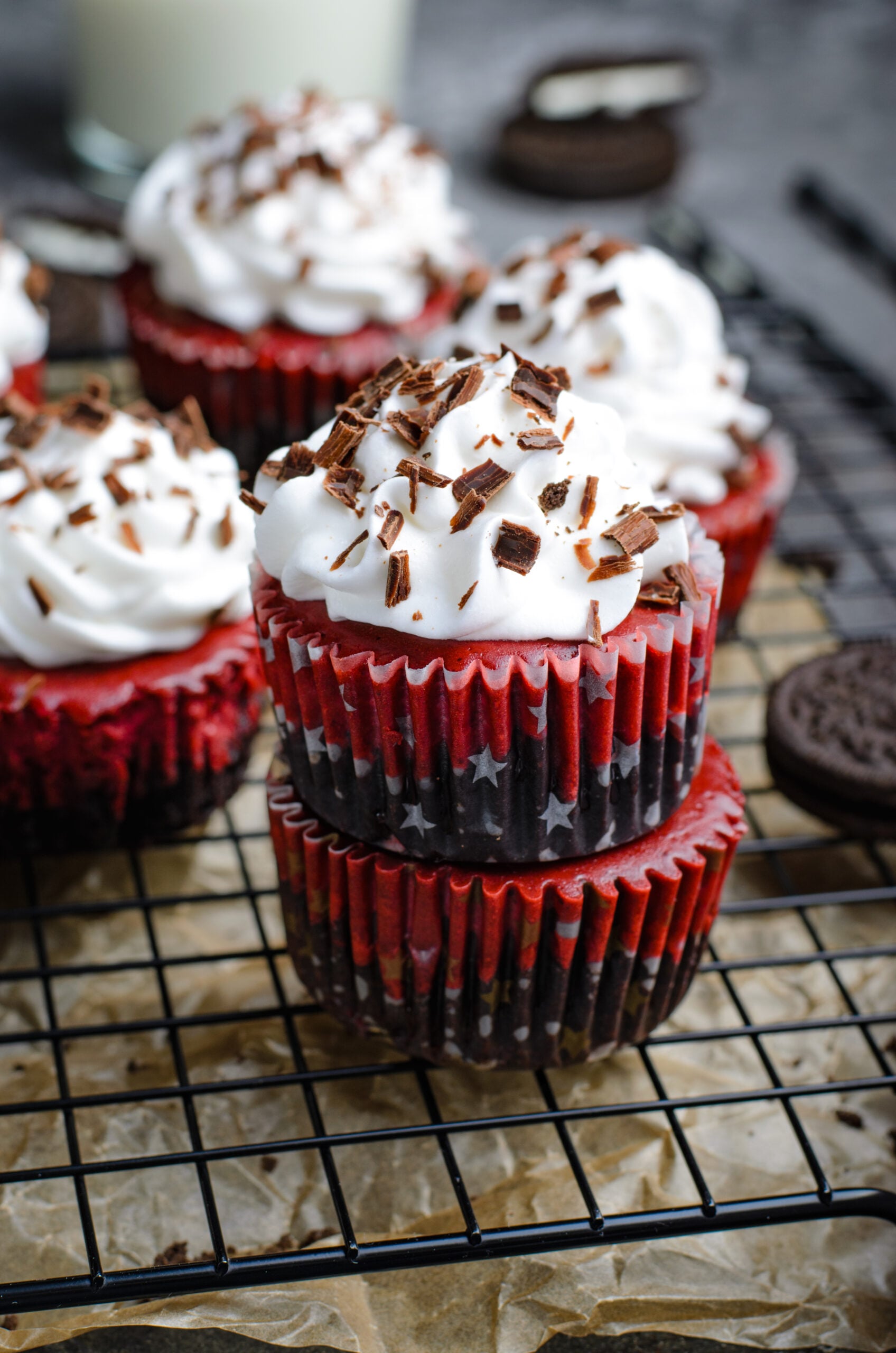Front view of three Mini Red Velvet Oreo Cheesecakes stacked.