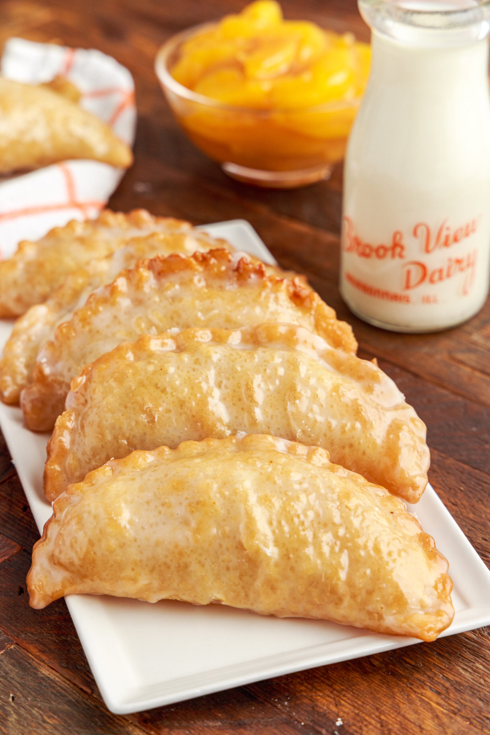 Front view of Peach Hand Pies on a white serving dish.