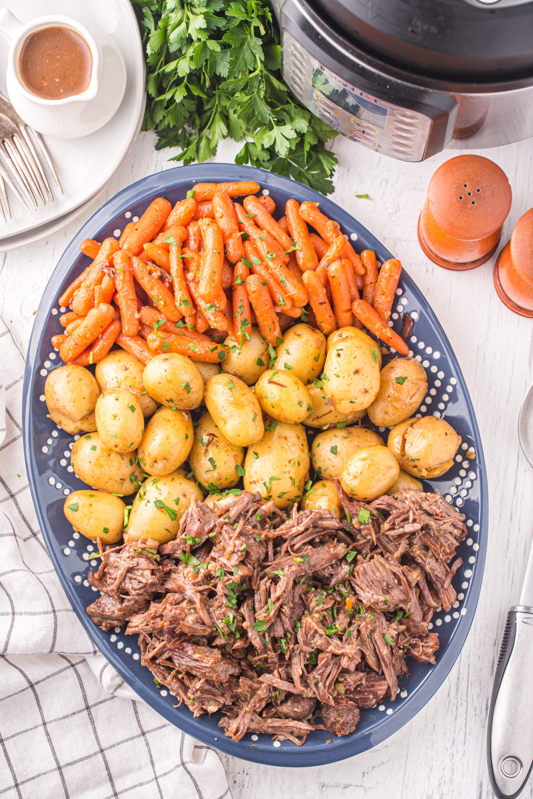 Overhead view of the finished pot roast, potatoes, and carrots.