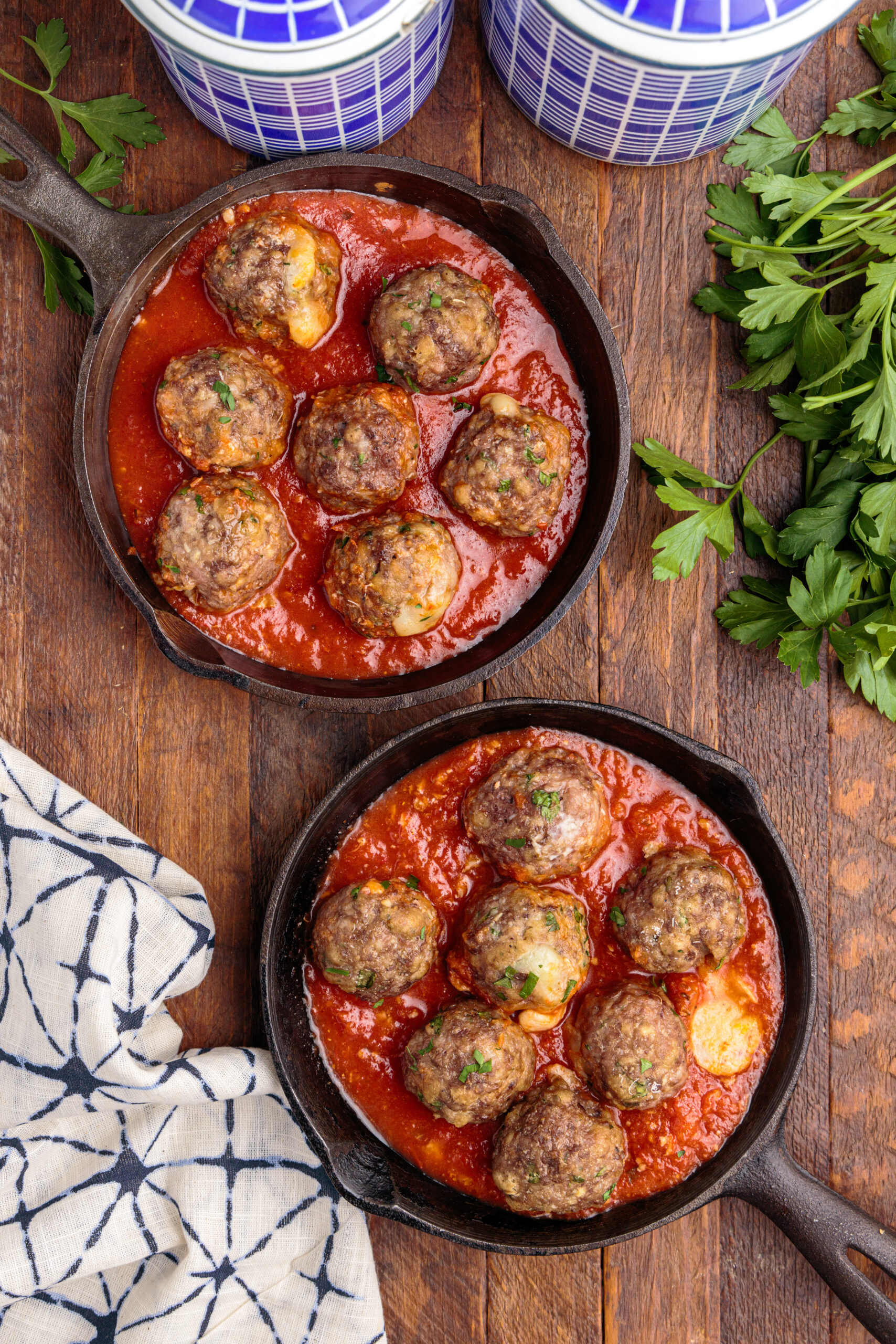 Overhead view of Mozzarella Stuffed Meatballs in a cast iron skillet.