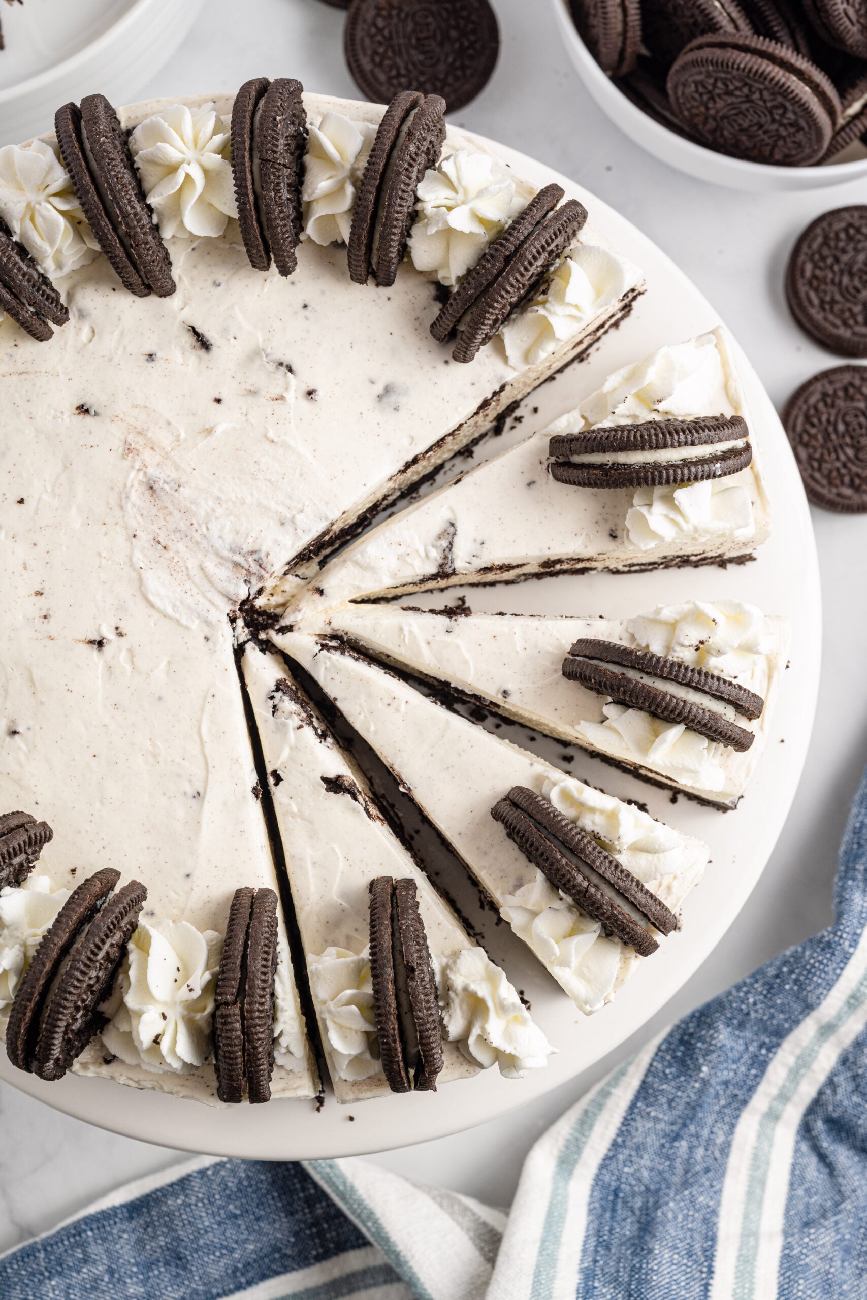 Overhead view of No Bake Oreo Cheesecake with four slices cut.