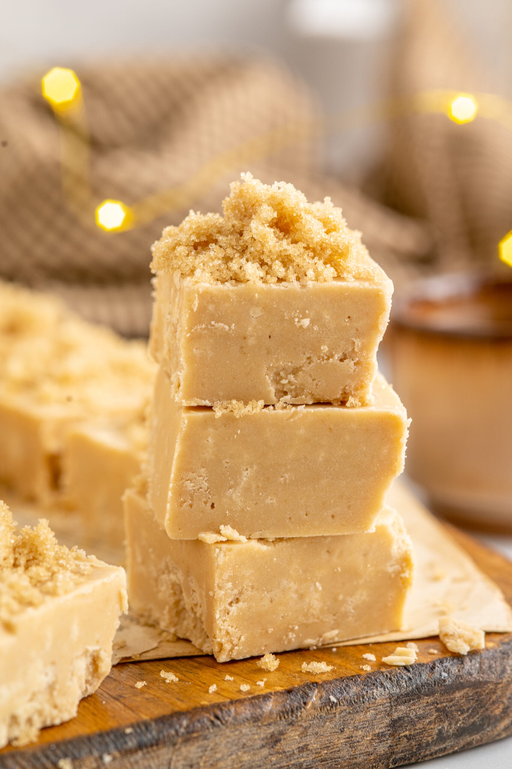 Side view of three pieces of Penuche Fudge stacked.